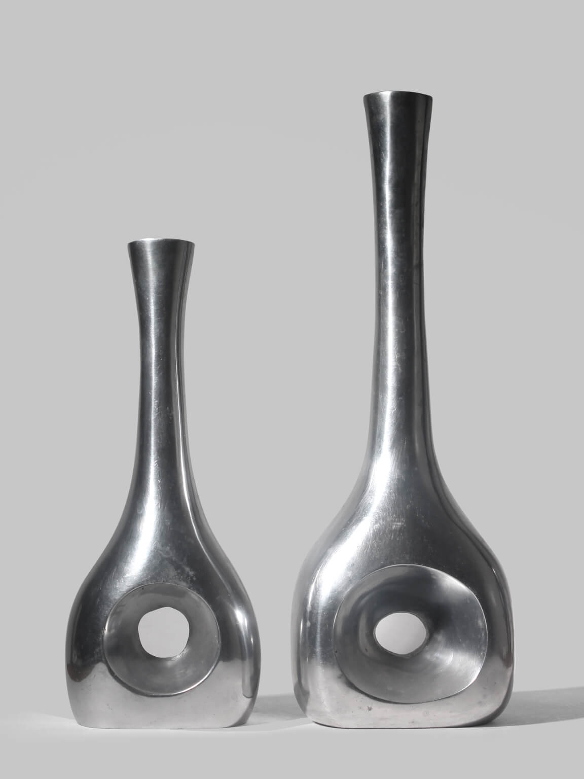 Polished Aluminum Circular Cutout Tall Vases Set by Vintage Stories | The Oblist