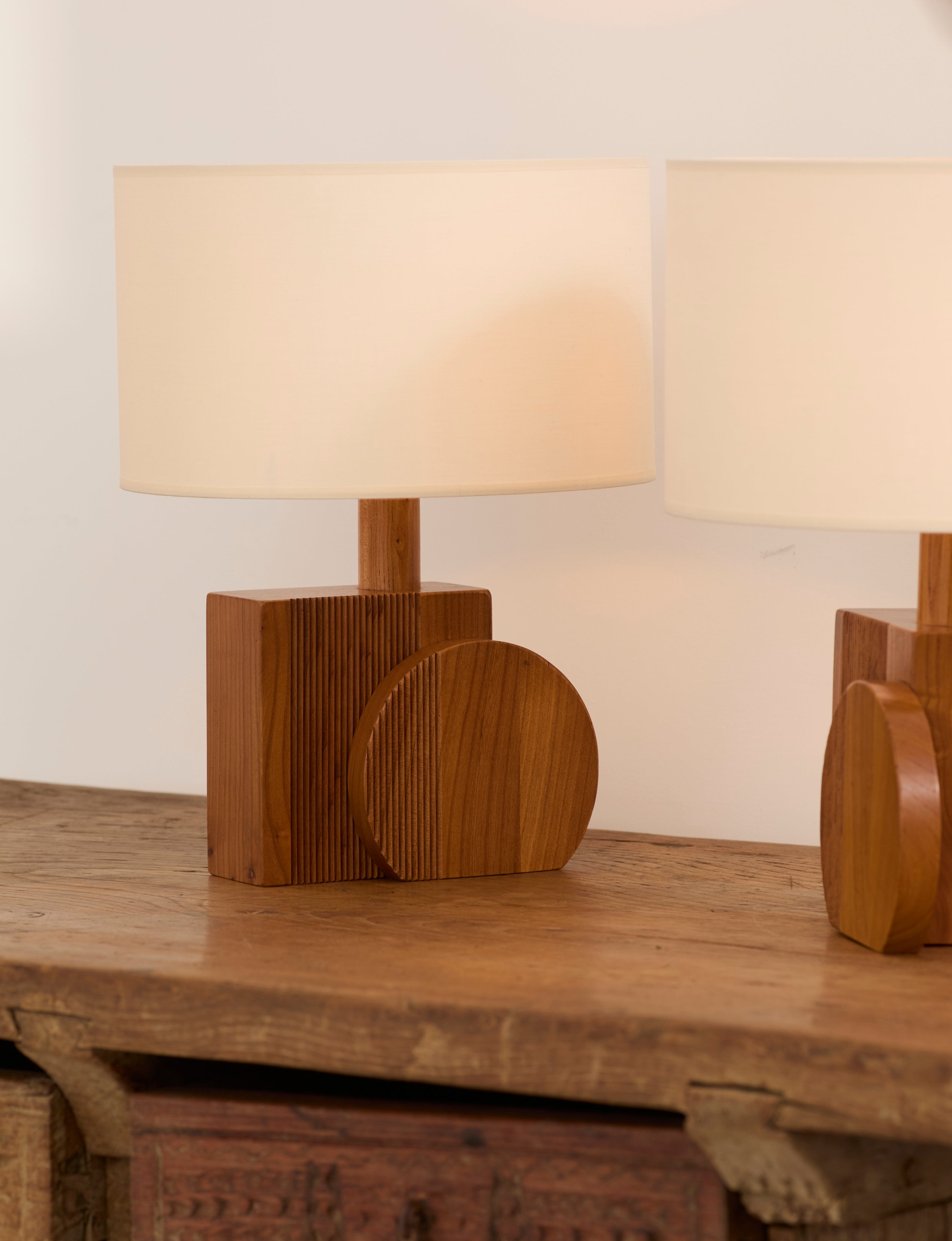 Set of 2 Vintage Artisanal Table Lamps In Solid Wood From France c. 1970 — back view showing round wooden base and fabric sha
