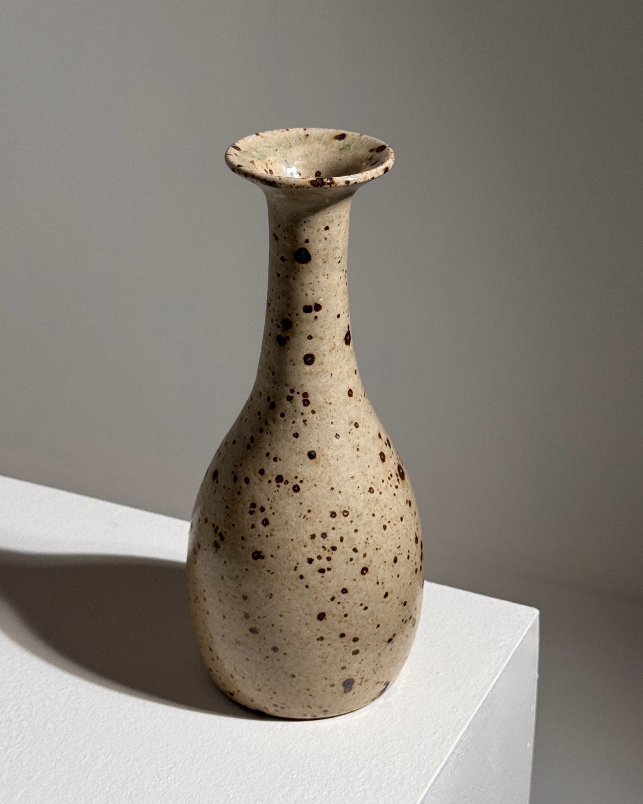 Cream stoneware soliflore vase with brown speckled glaze detail