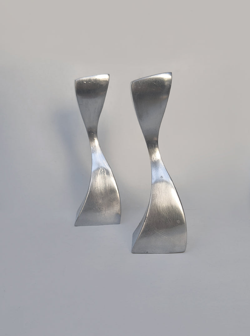 Twisted Candle Holders — close-up of polished metal surface