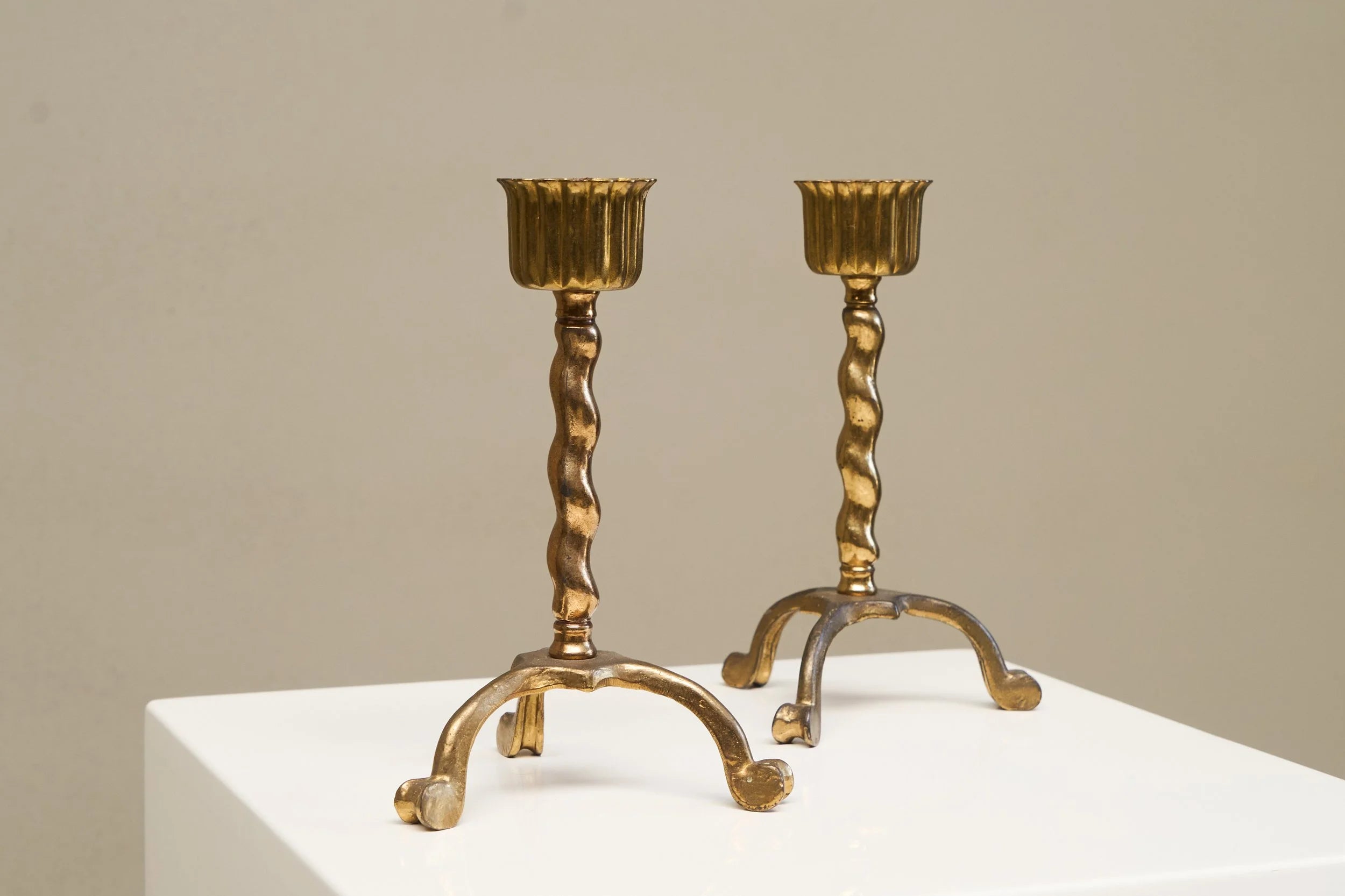 Wonderful Pair of Tripod Table Lamps in Patinated Sand Cast Brass with Raffia Shades — lifestyle setting