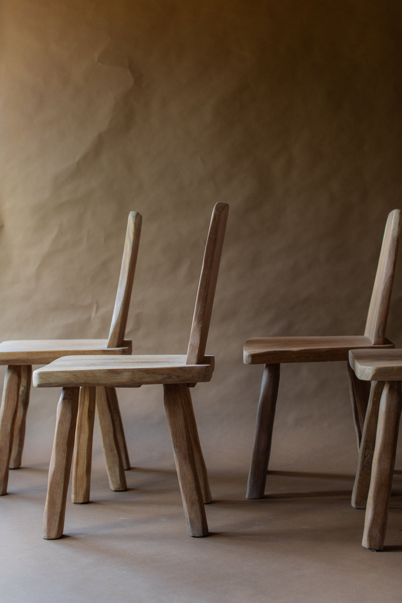 Set of four natural wood brutalist chairs with vertical backrests