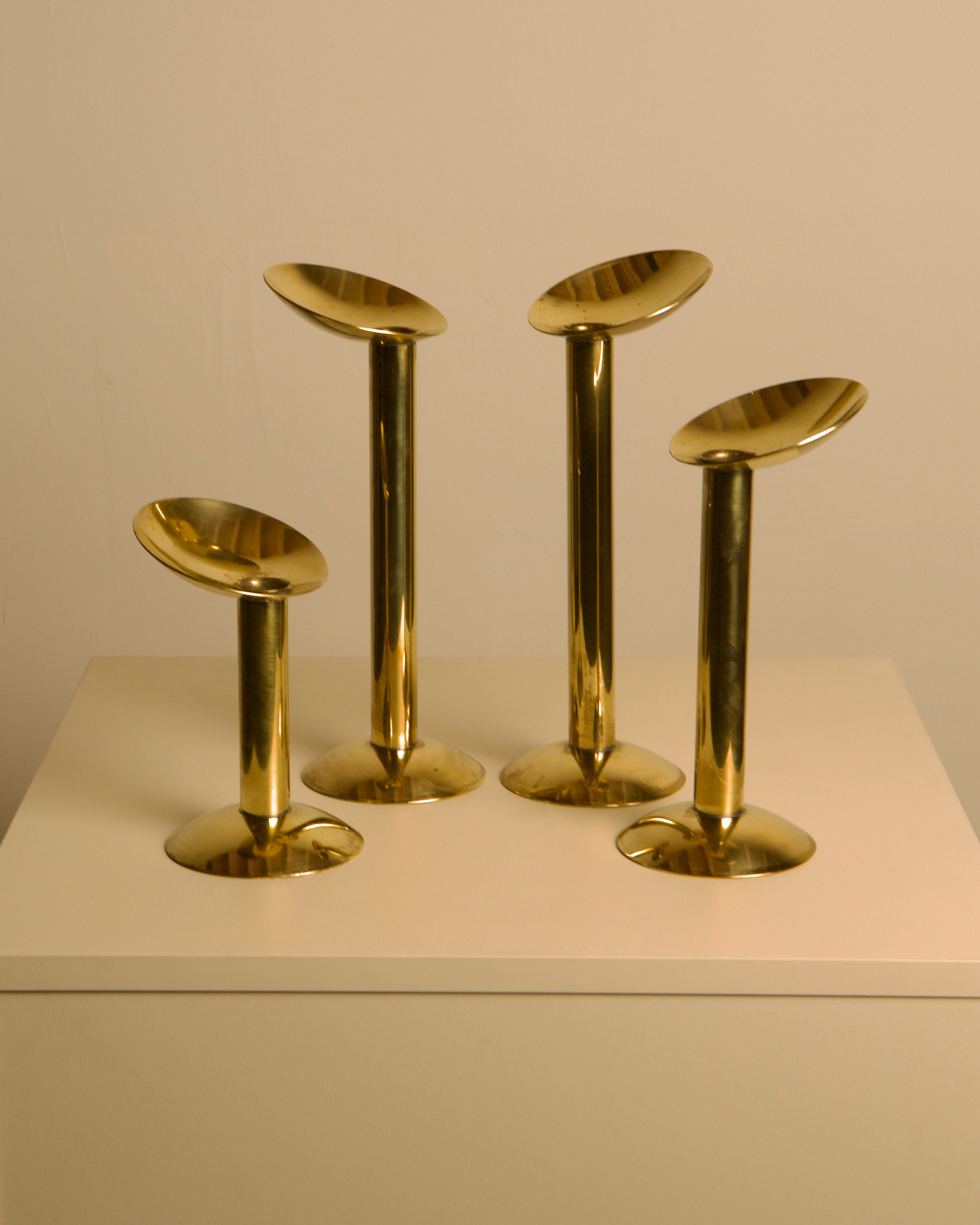 Set of 4 Danish brass candlesticks from the 1960s by Treaptyque | The Oblist