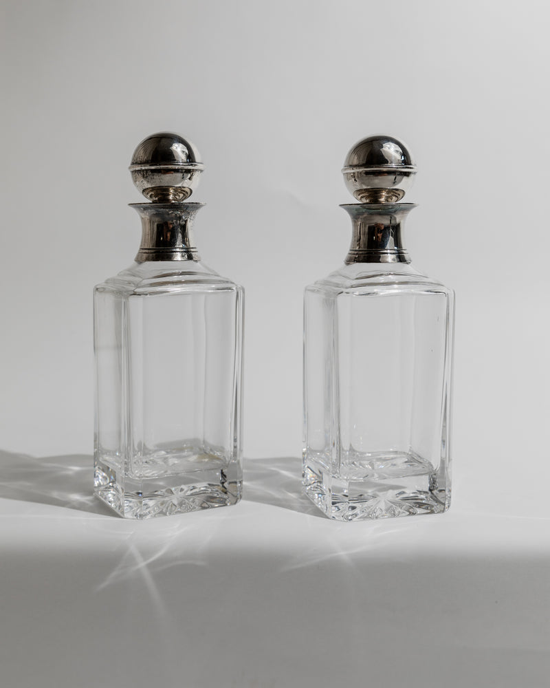 Pair of crystal decanters with silver tops from 1950s