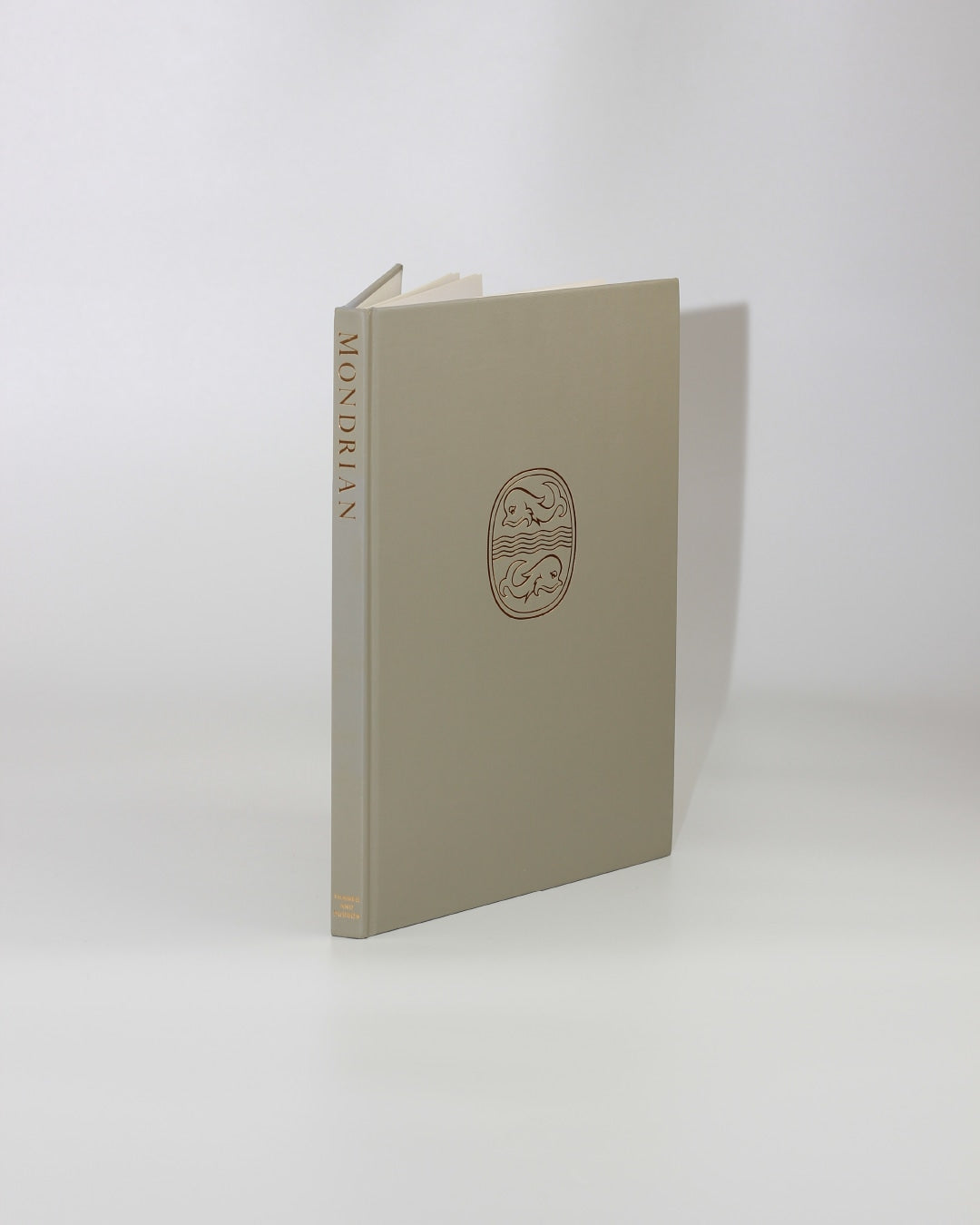 Mondrian — back view of beige hardcover with embossed design