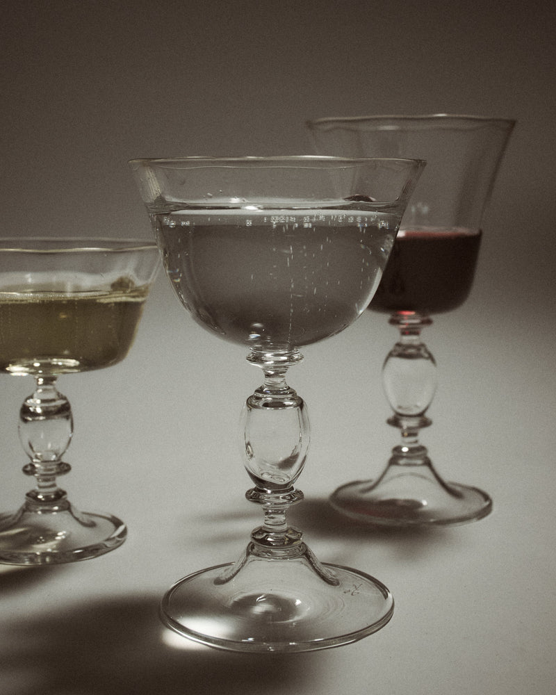 Alban Champagne Glass - Set of Four — close-up of crystal glasses with drinks