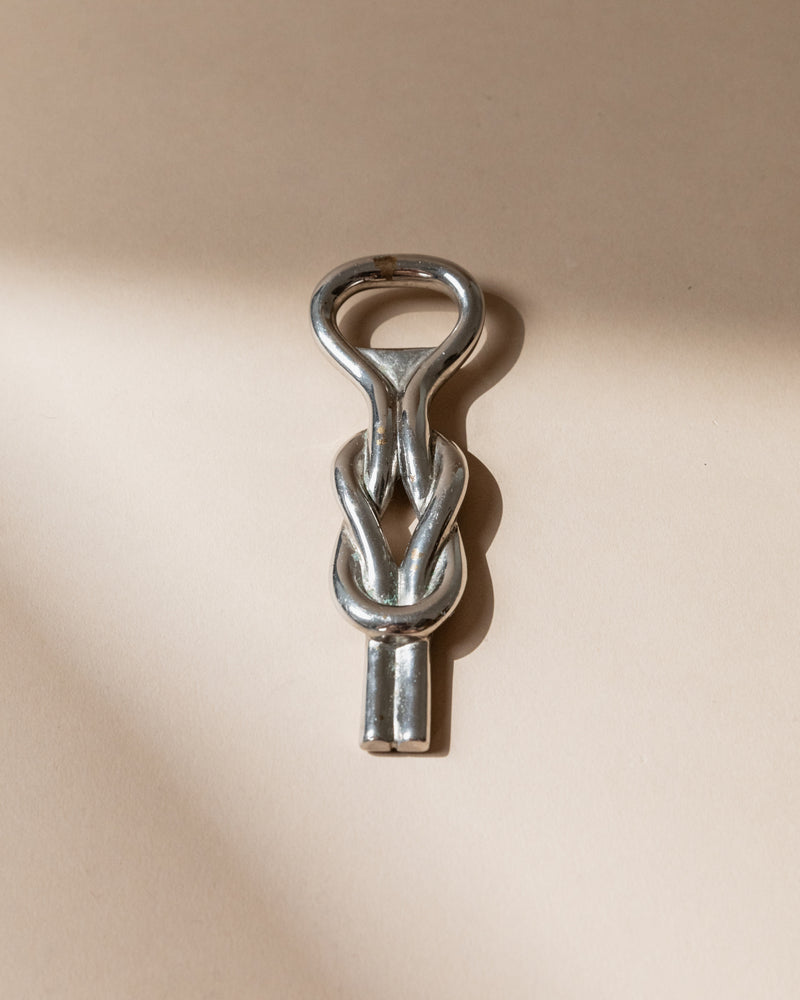 Silver plated bottle opener with twisted knot design, Italy 1960s
