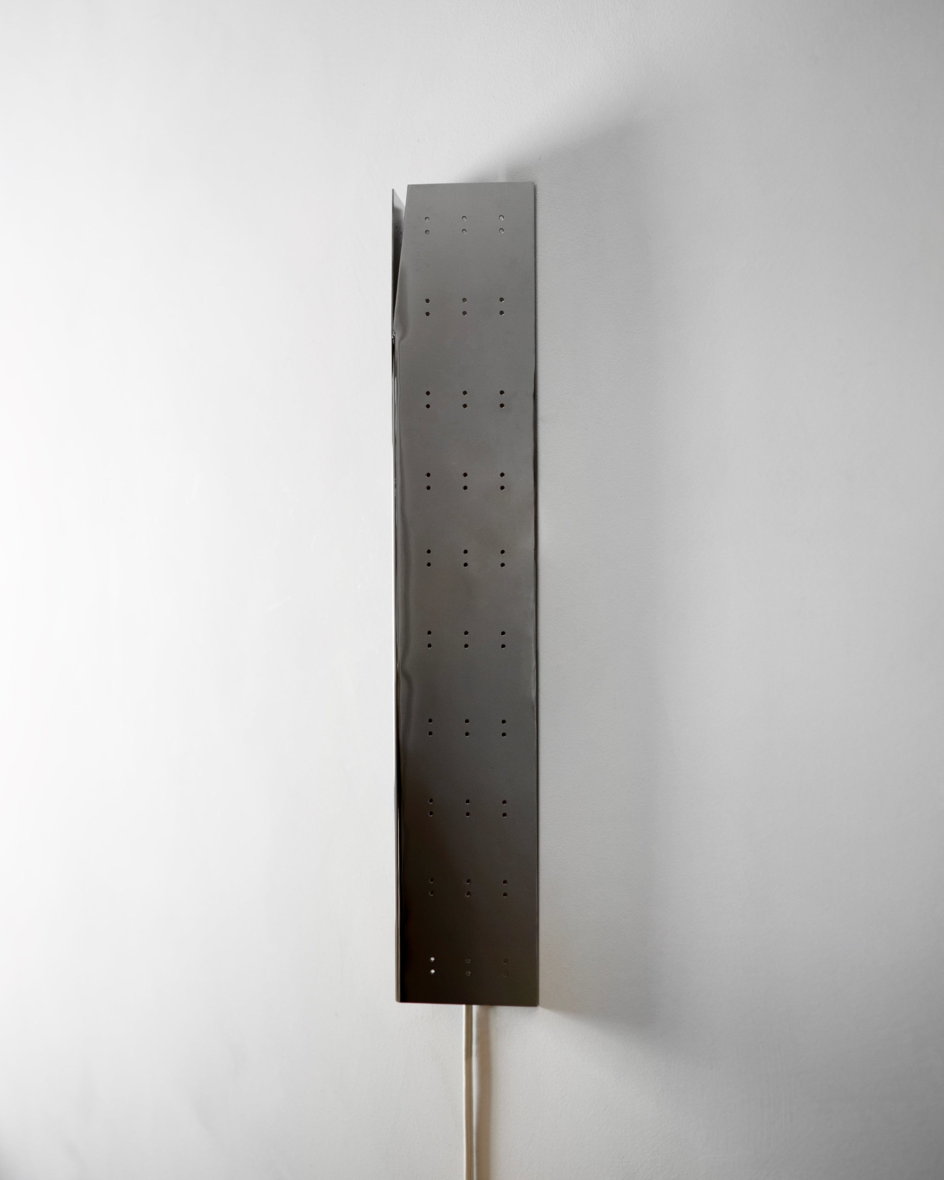 May Wall Lamp - Polished Steel — side view showing perforated metal design