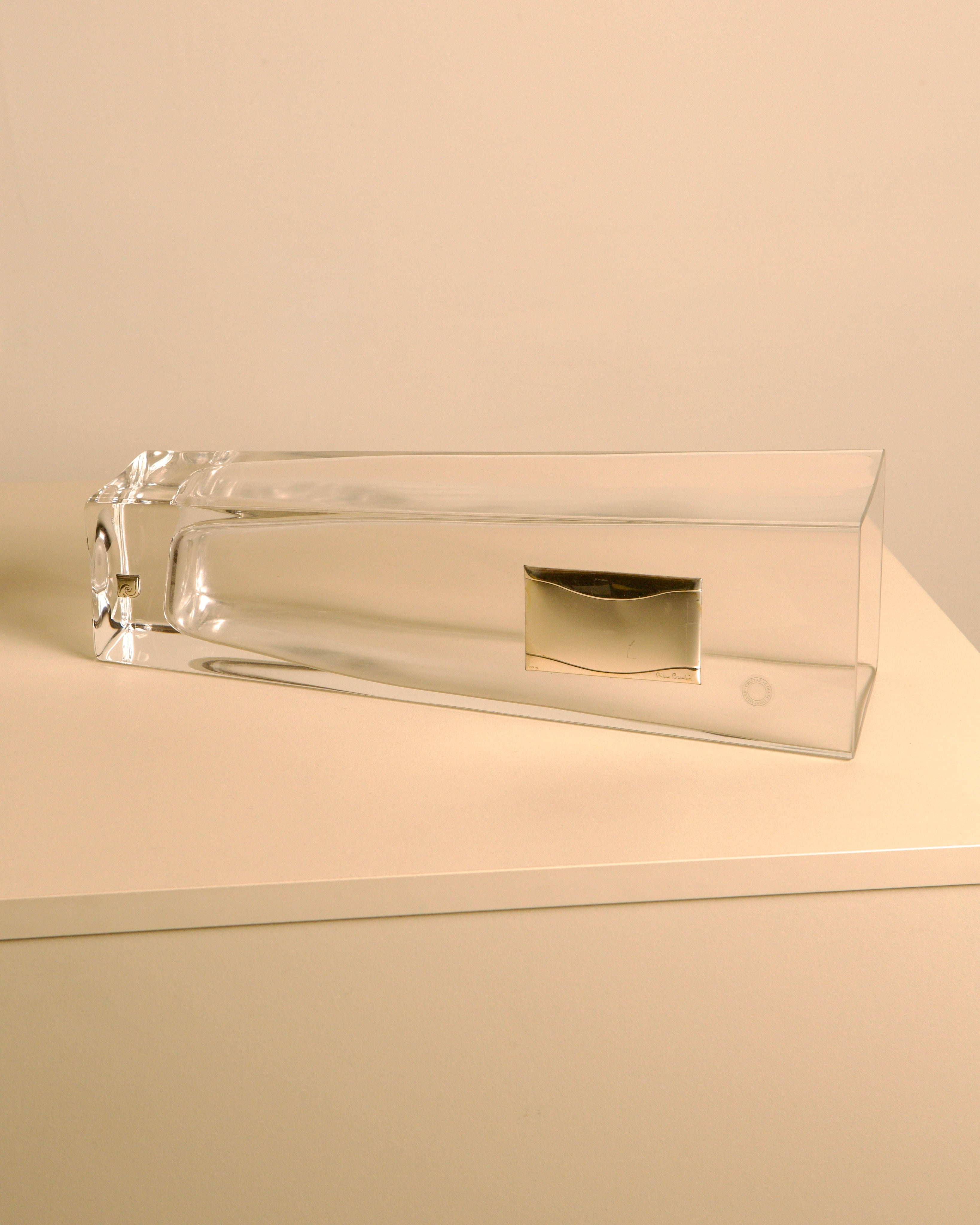 Glass vase with metal details by Pierre Cardin, 1980s — top view on neutral background