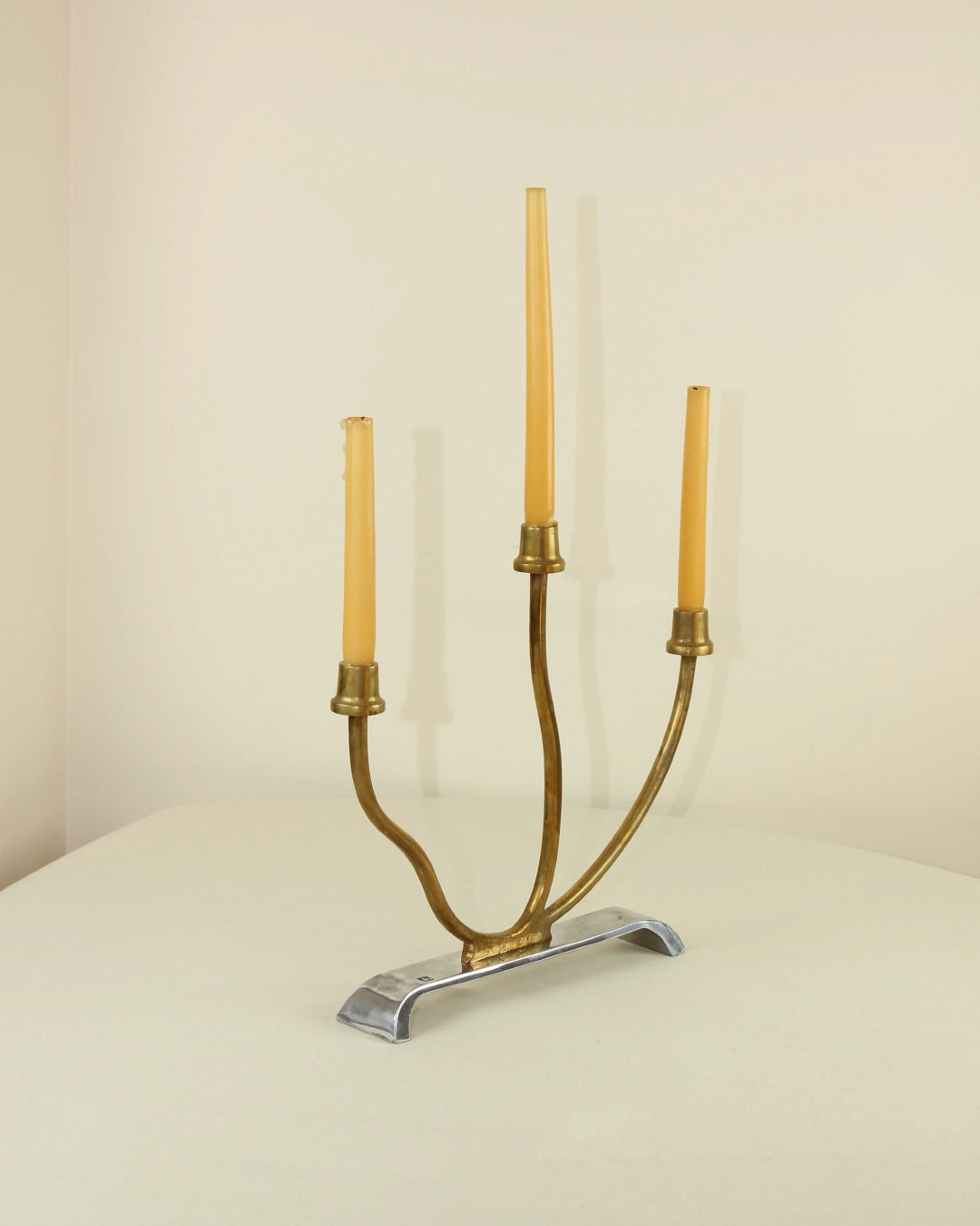 Brutalist Candleholder — side angle view with brass and silver materials