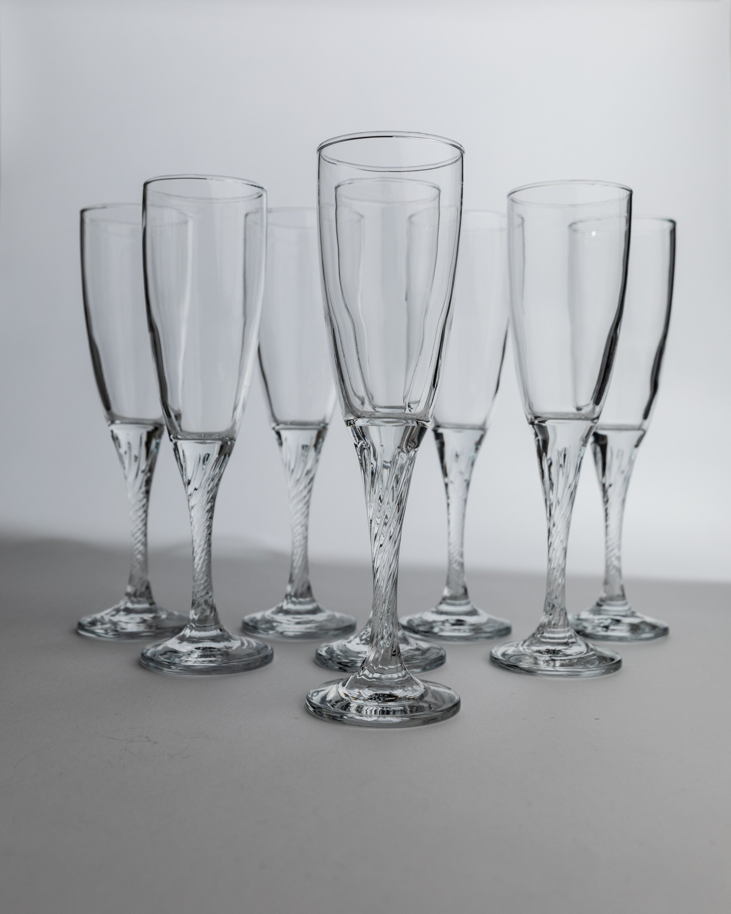 Set of 8 vintage 1980s champagne flutes with twisted crystal stems