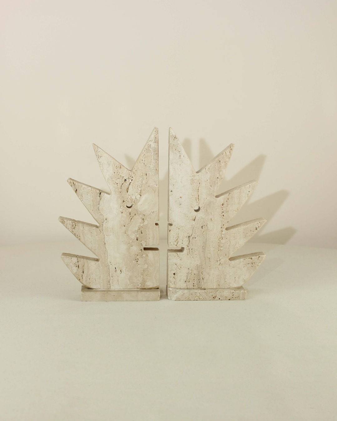 Pair of Travertine Bookends by Fratelli Mannelli — side angle showing textured stone design