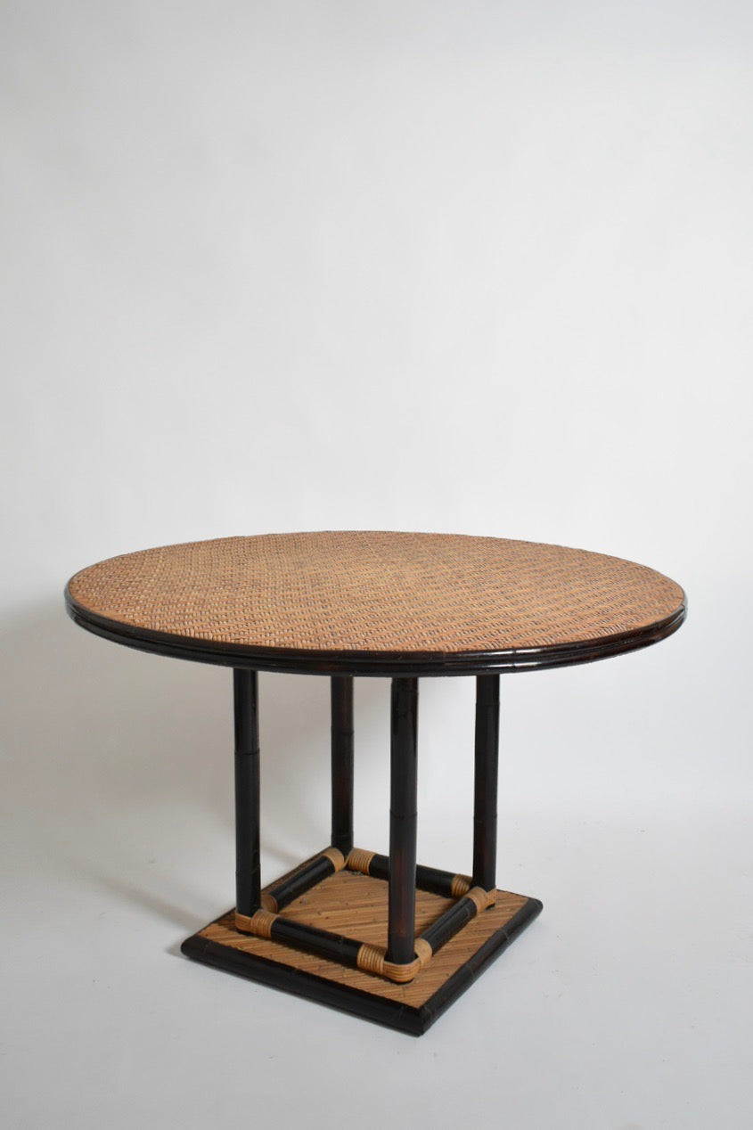 Bicolor round rattan dining table — lifestyle setting