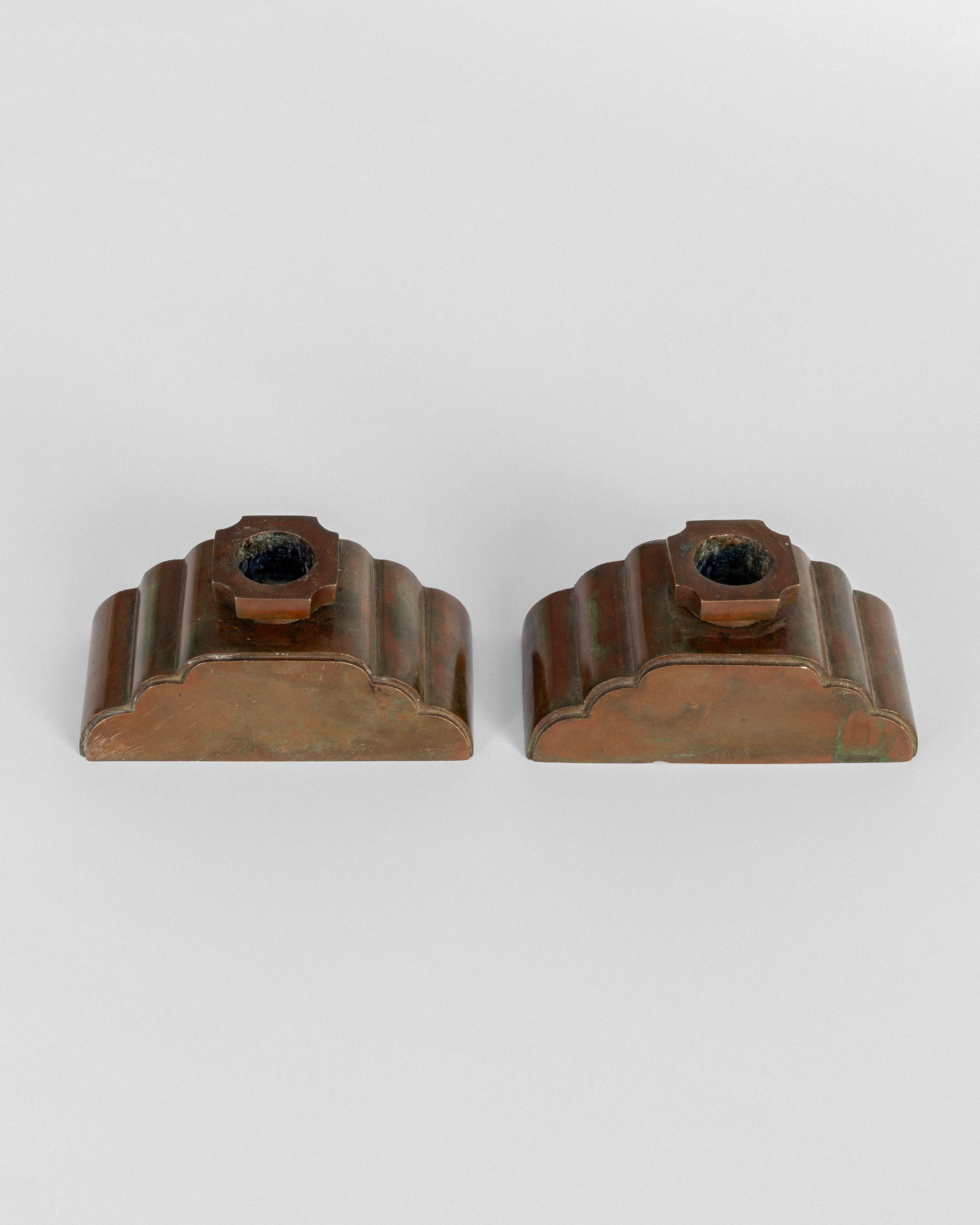 Pair of bronze candleholders front view by Sune Bäckström 1930s