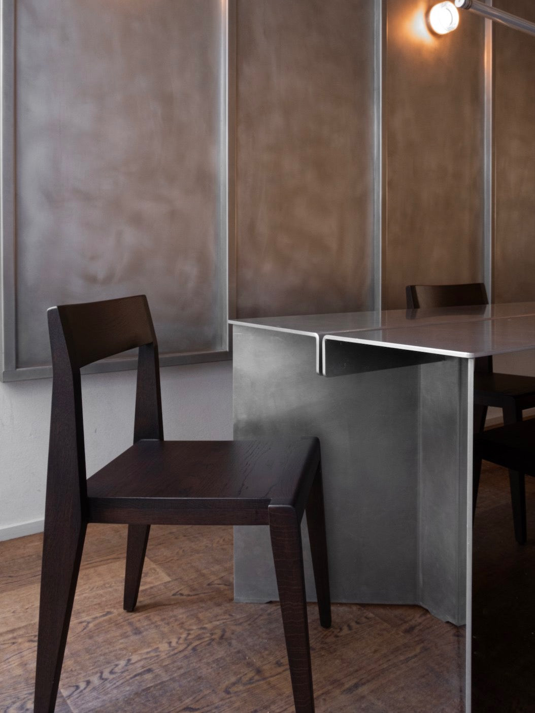 Chair - Ed. Espresso - Oak — angled view beside modern metal table
