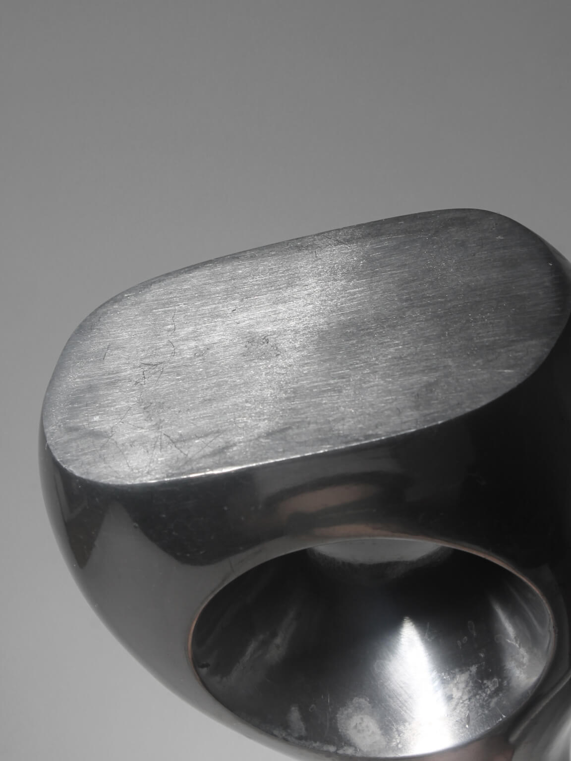Polished Aluminum Circular Cutout Tall Vases Set — close-up