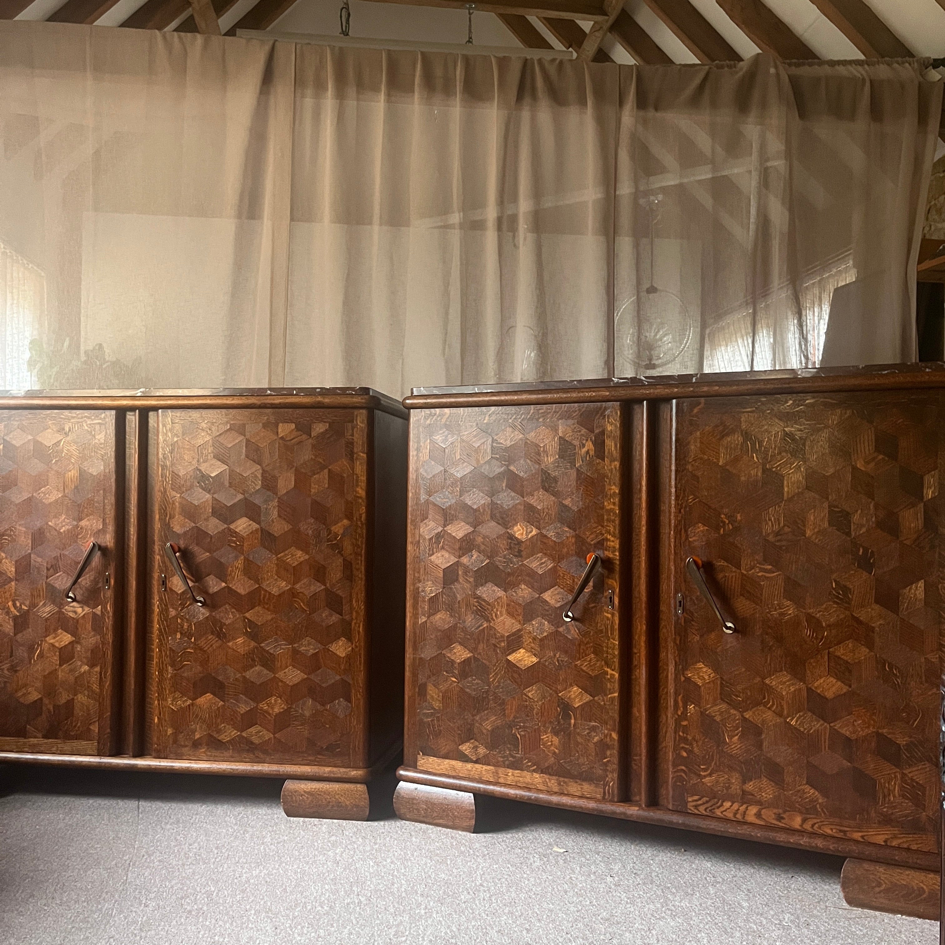 Pair of Art Deco Belgian Parquetry Cabinets with Rose Marble Tops — angled view showing geometric wood pattern and handles