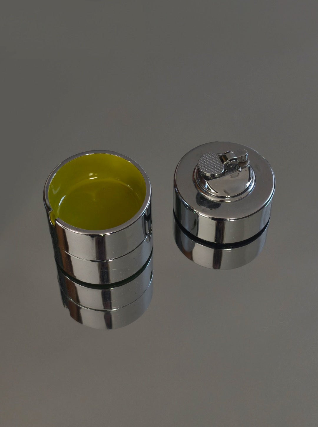 Vintage Ashtray and Lighter by Isamu Kenmochi, 60's — side angle showing chrome finish and yellow interior