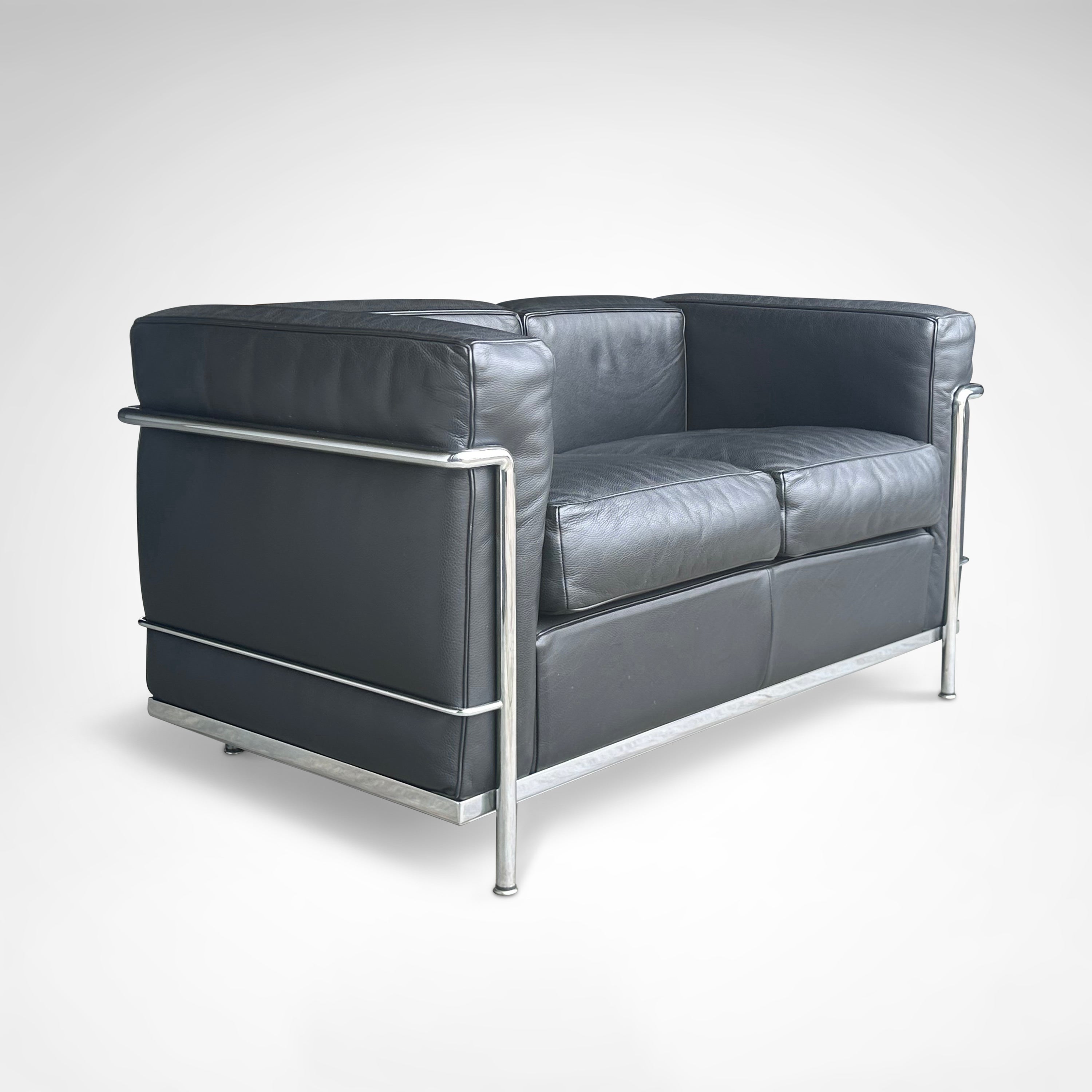 LC2 2-seater sofa by Le Corbusier et al. for Cassina 1990s — angled view highlighting black leather upholstery