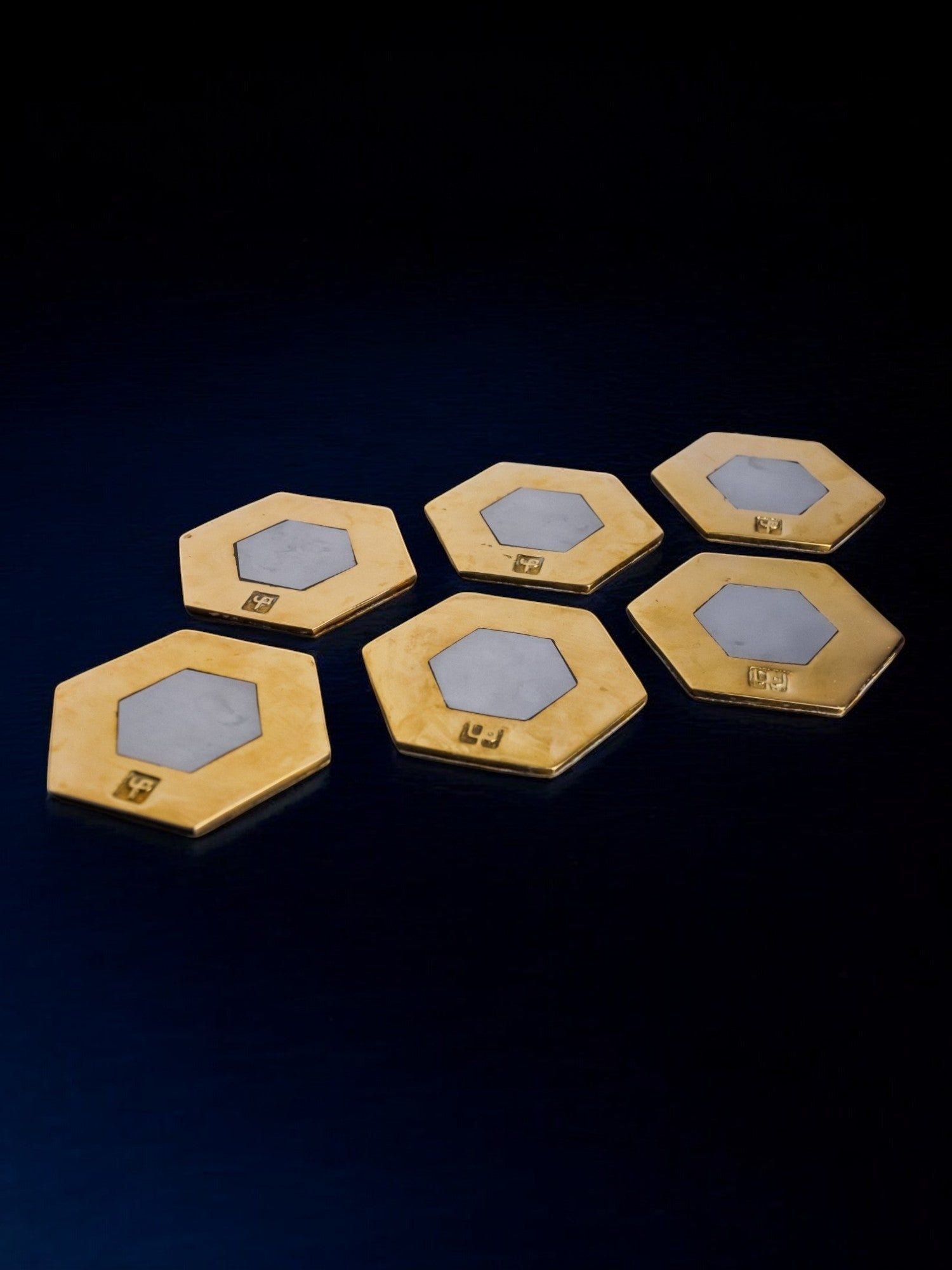 Set of 6 Brutalist Coasters by David Marshall, Spain, 1970s — angled view on dark surface
