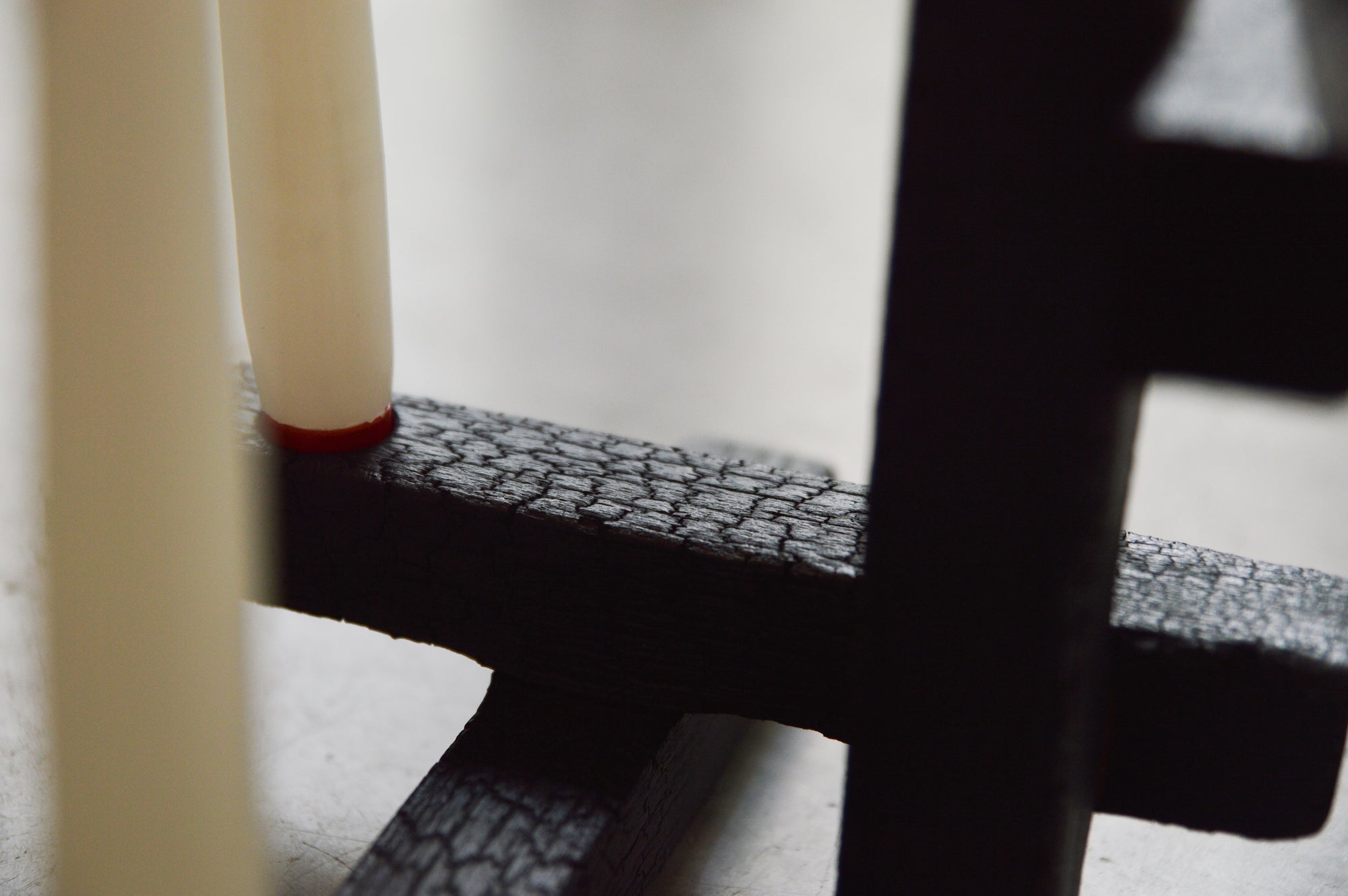 TETRIS 5 — side angle highlighting textured black wood base