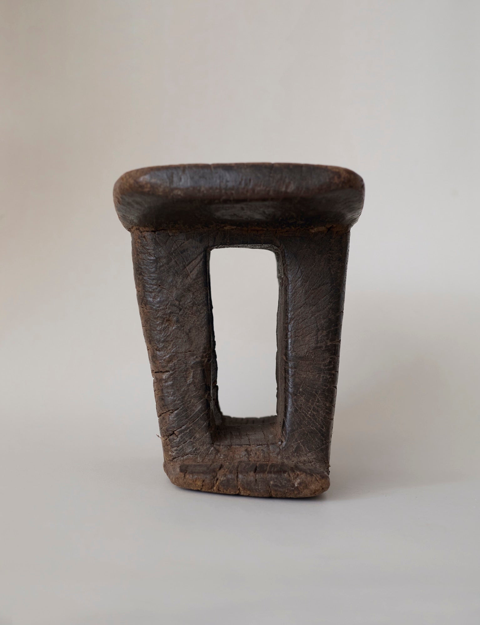 West African Monoxyle Stool in Dark Patinated Wood — in context