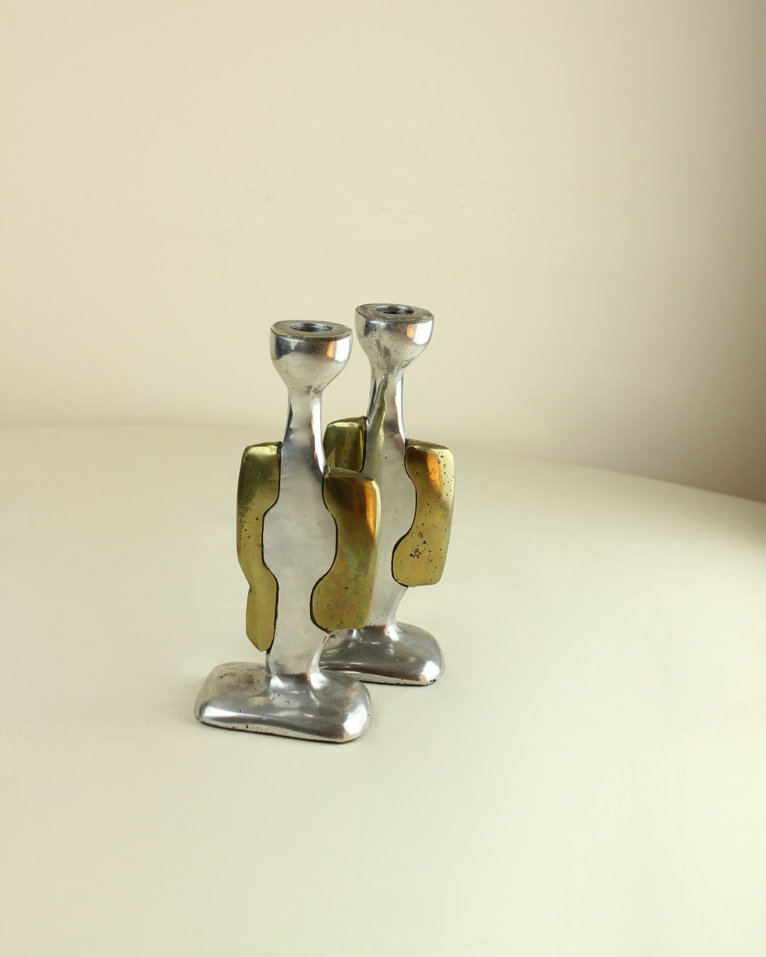 Brutalist Candleholders — angled view on light-colored table