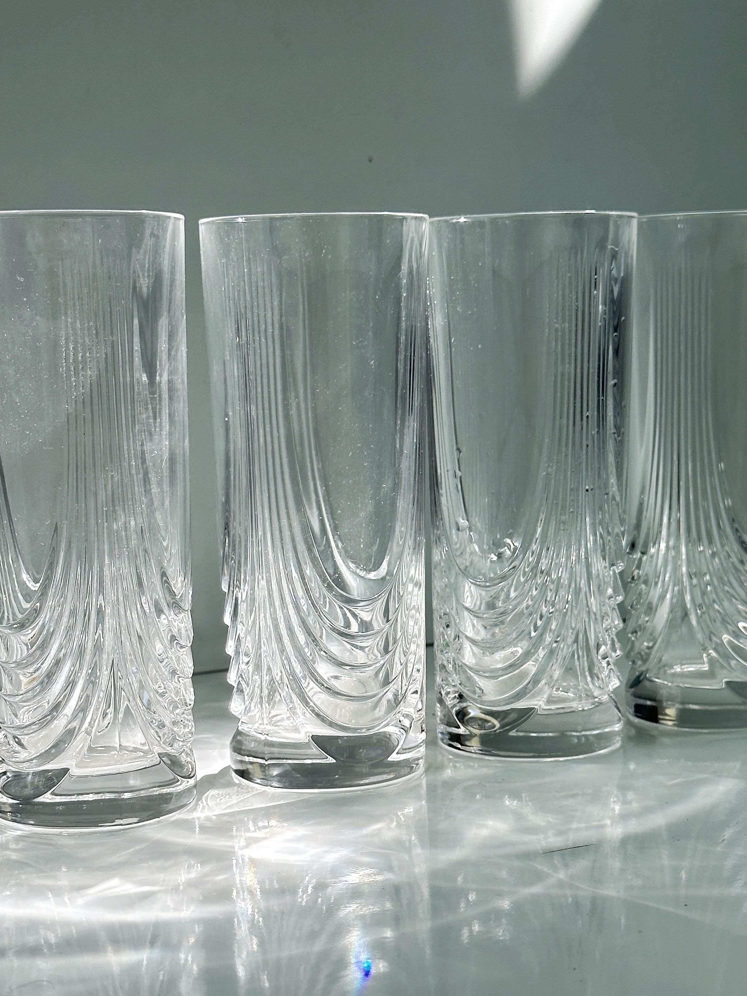 2 Italian Art Deco Crystal Glass Sets of 8 and 6 — close-up of textured crystal glasses on white surface