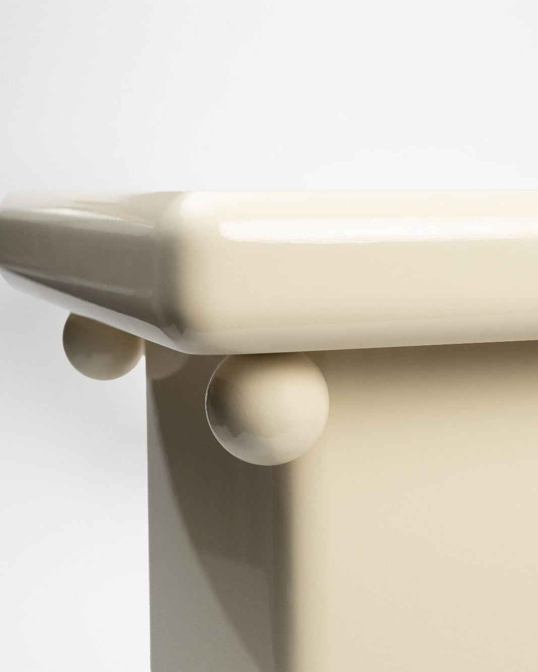 Stool - Cream — close-up of glossy cream surface and rounded edges