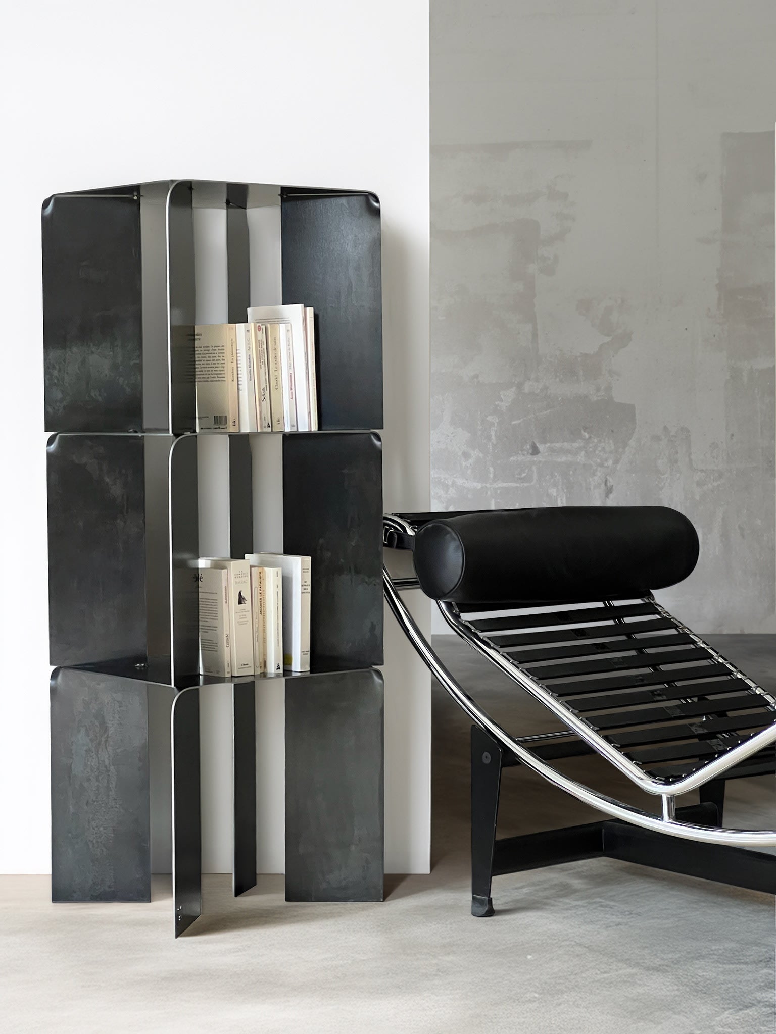 TOMO Shelves — close-up of black metal shelves with books