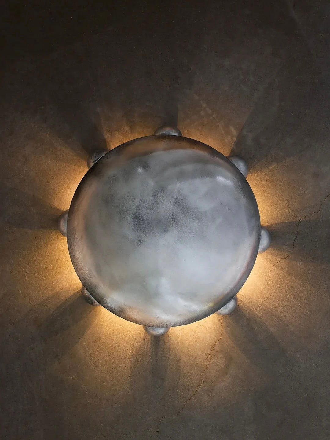 ALTER Sconce | Aluminium — overhead view on textured wall