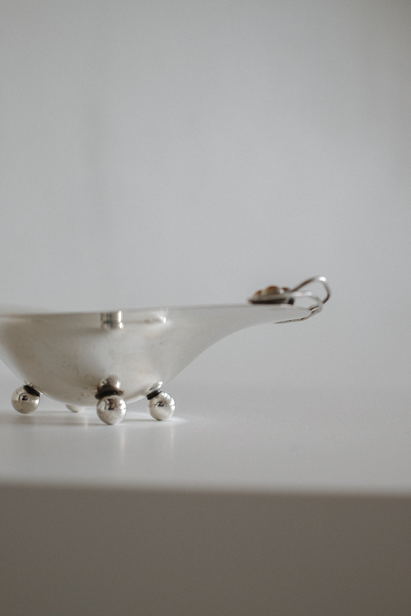 Small Silverplated Bowl — side view on white surface