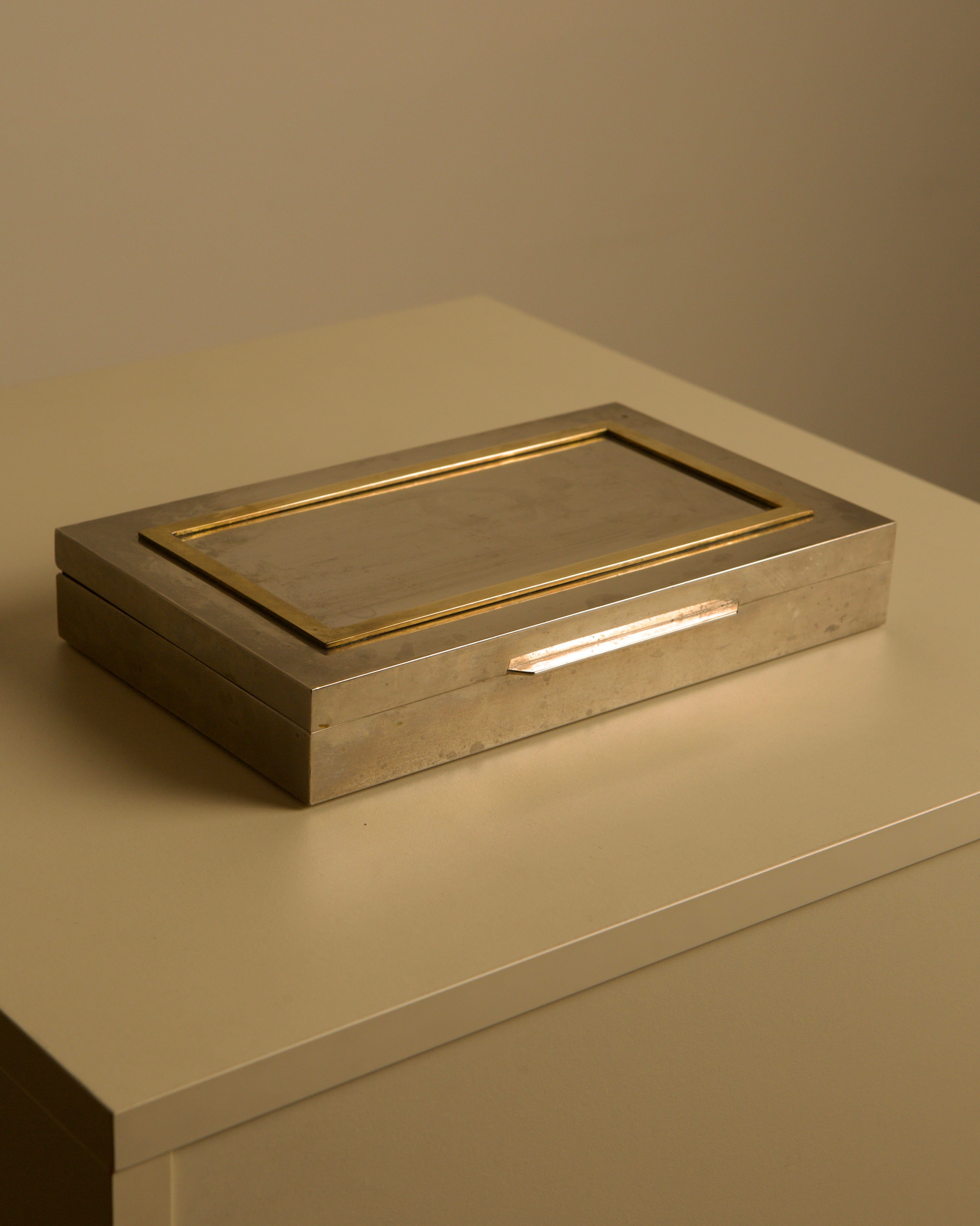 Large Italian metal and brass box with wooden interior, 70s — angled view on neutral surface