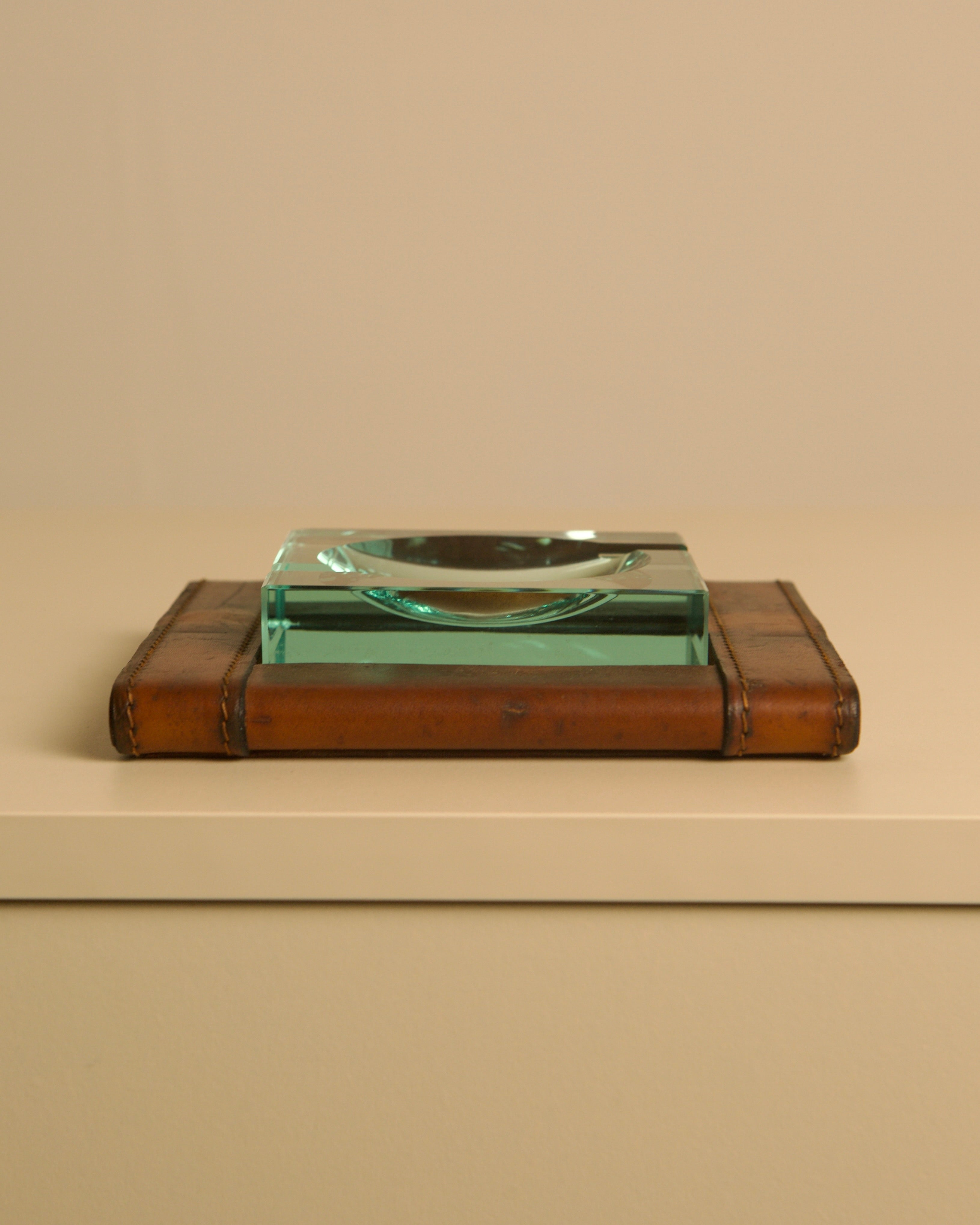 Square Italian Ashtray by Fontana Arte, 1960s — side angle on leather surface