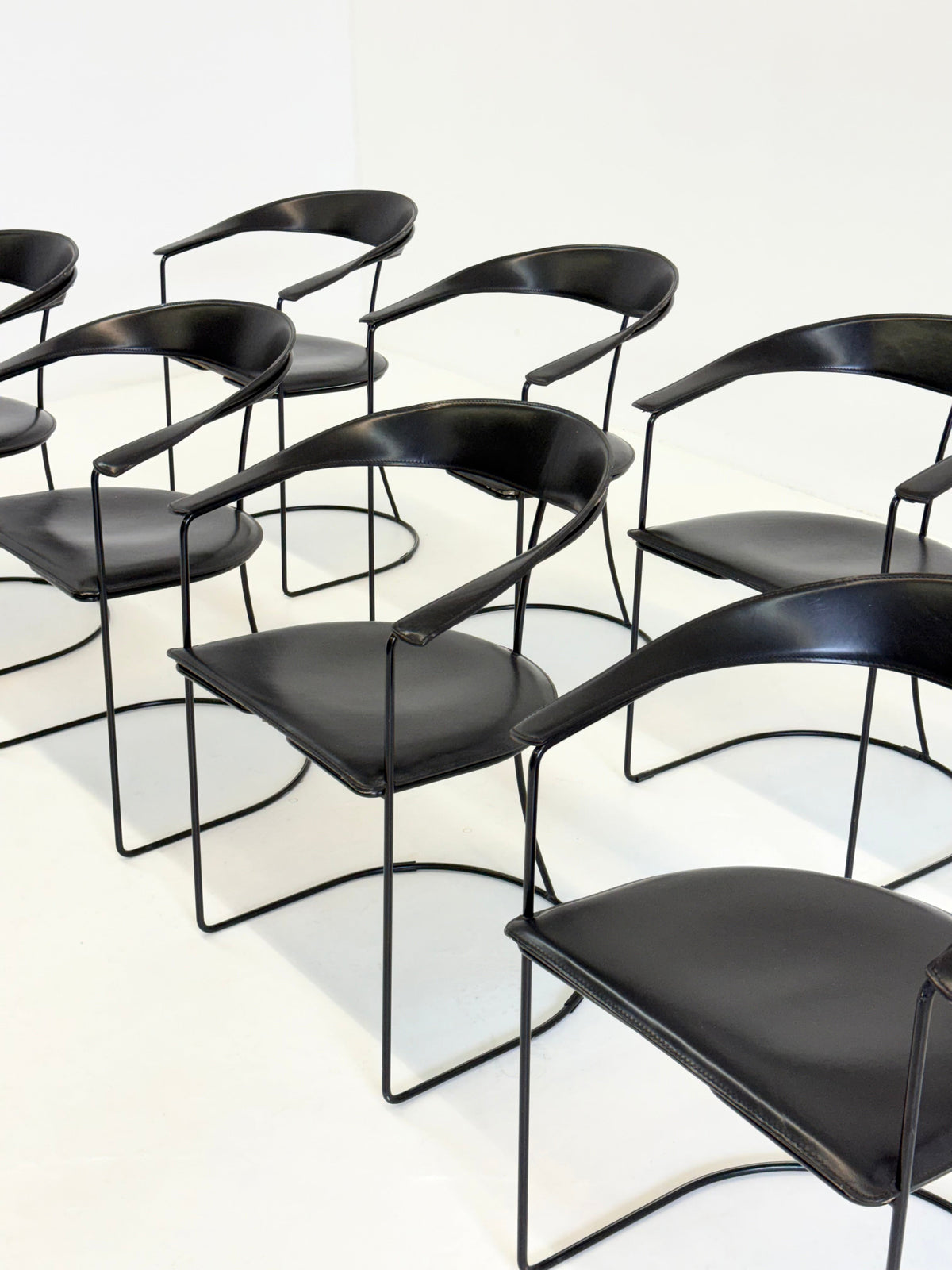 Set of 8 Vintage Arrben Ursala dining chairs in black leather — lifestyle setting