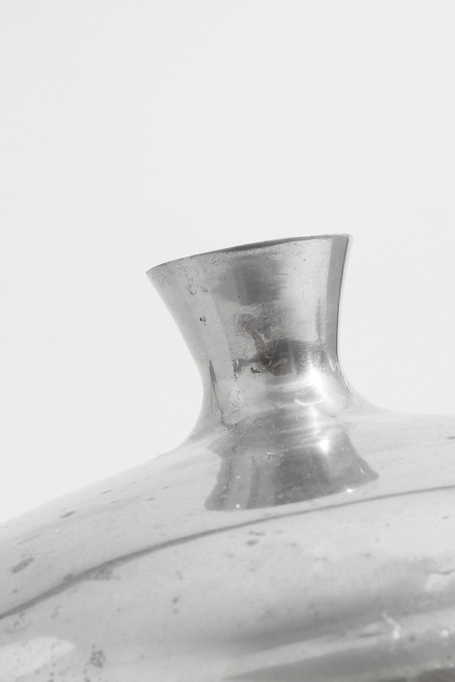 Form Sculpture Vase — close-up of reflective silver surface