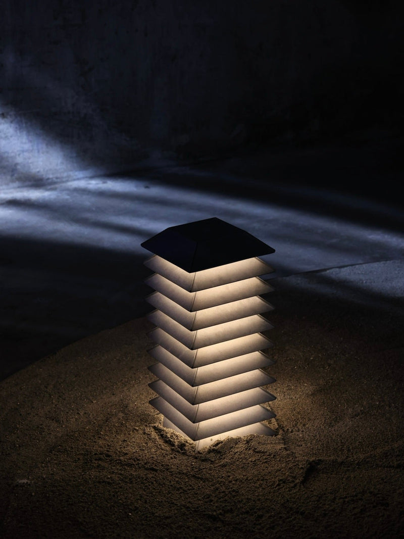 Pagoda Floor Lamp — close-up of layered white shade in dark setting