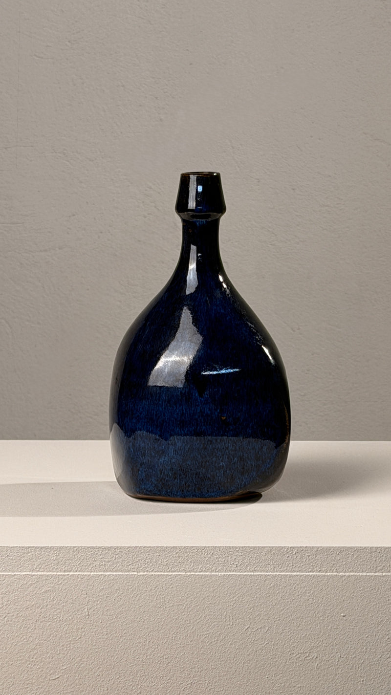 Ceramic vase/bottle, Atelier les Cyclades, Anduze, 1970. — close-up of dark blue ceramic surface
