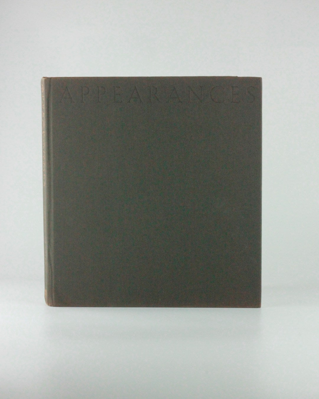 Appearances — front cover detail in dark brown material