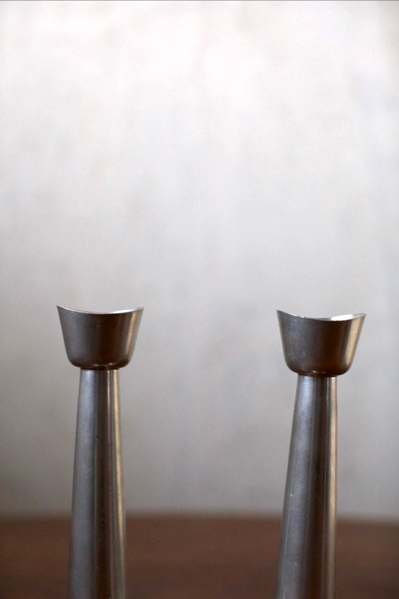 Steel Candleholders — close-up of polished steel surface