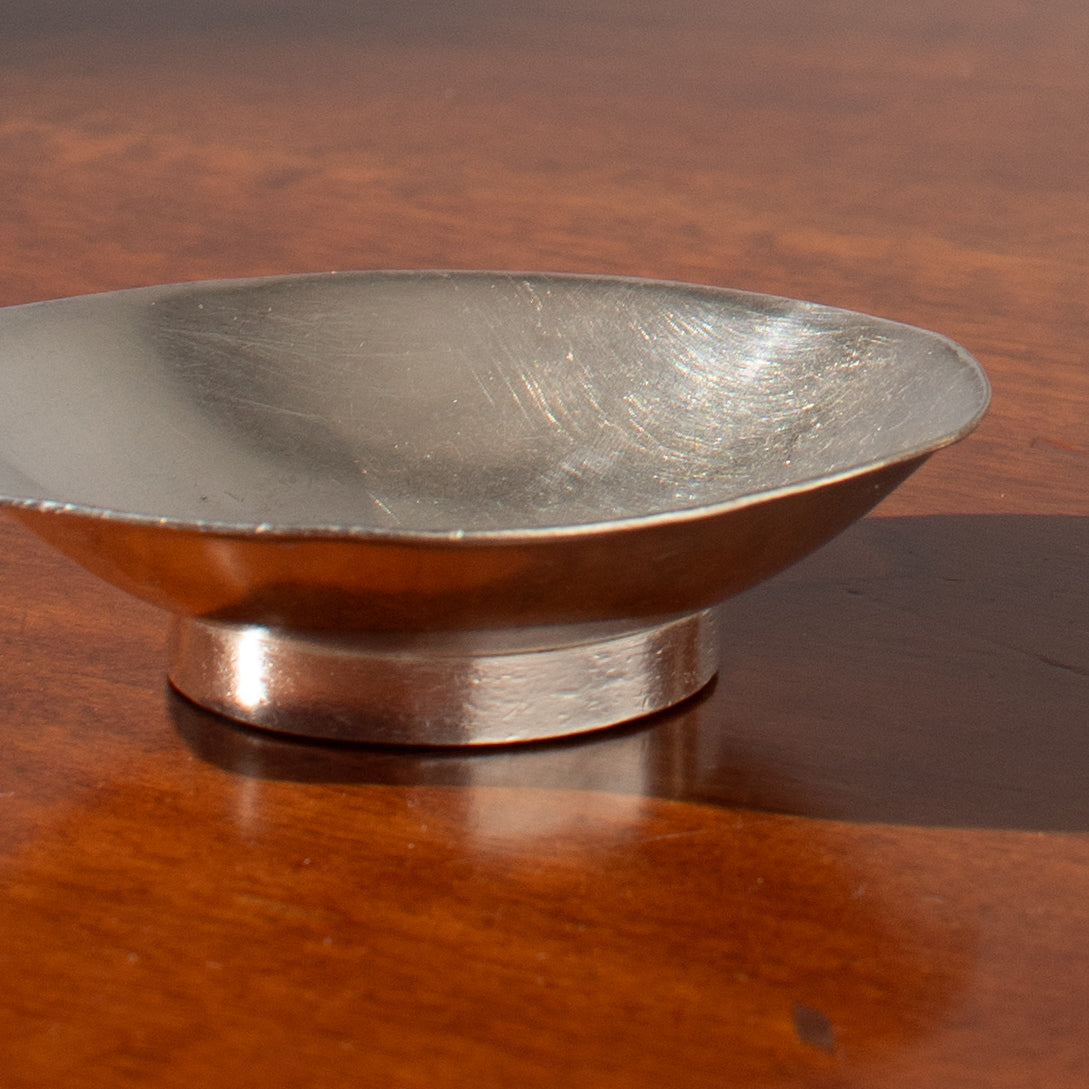 Arthur Krupp Dessert Plates in Metal — top view on wooden table