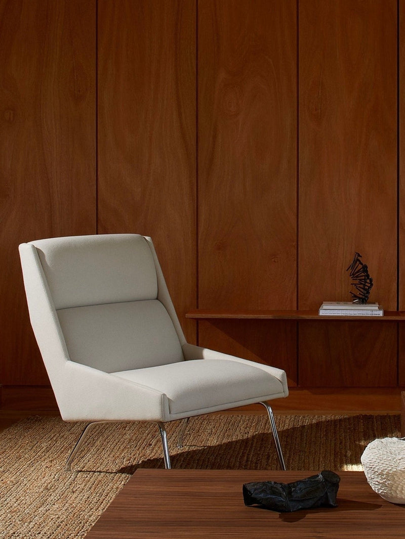 Kent Armchair — close-up of light gray fabric on modern frame