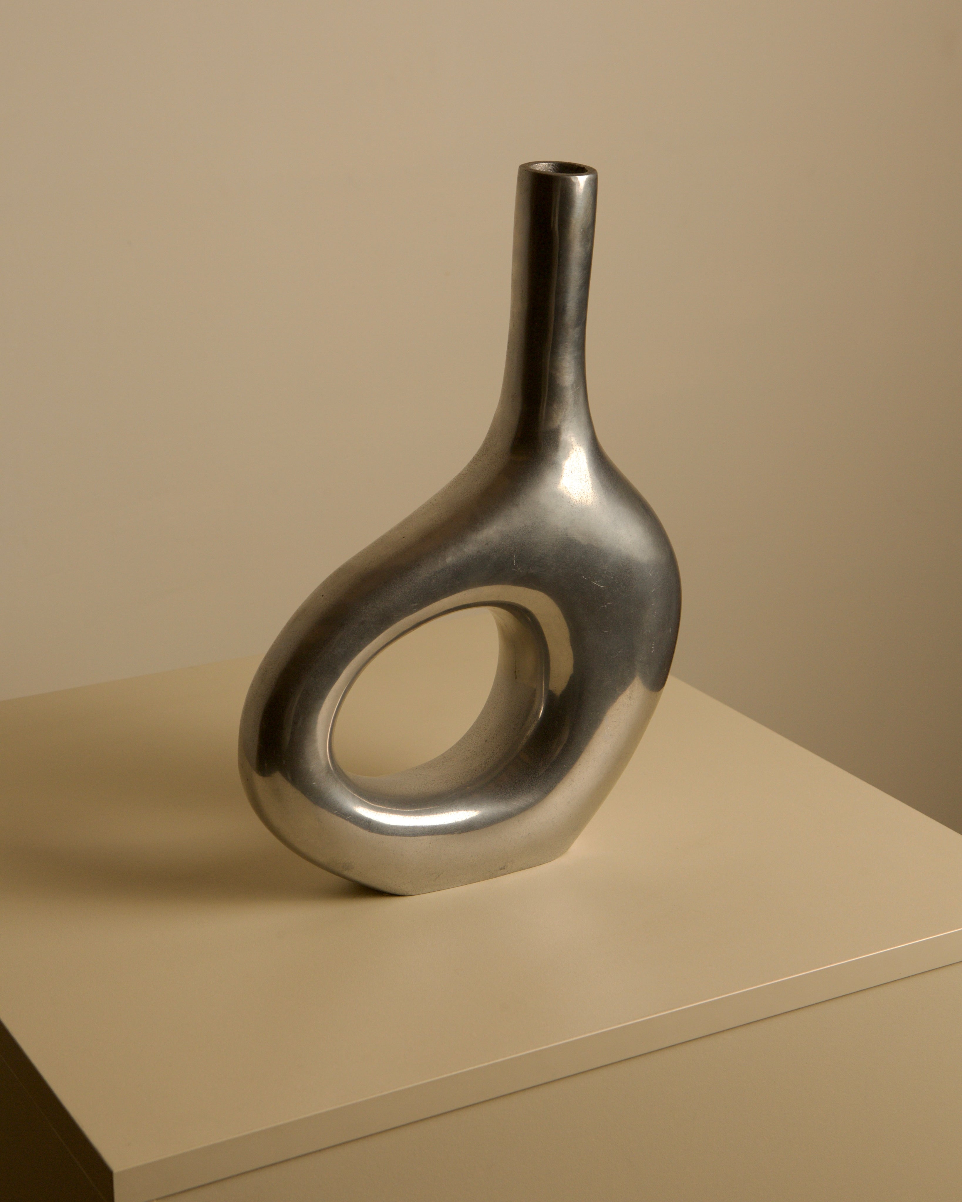 Italian Cast Aluminum Vase 80's — close-up of shiny aluminum surface