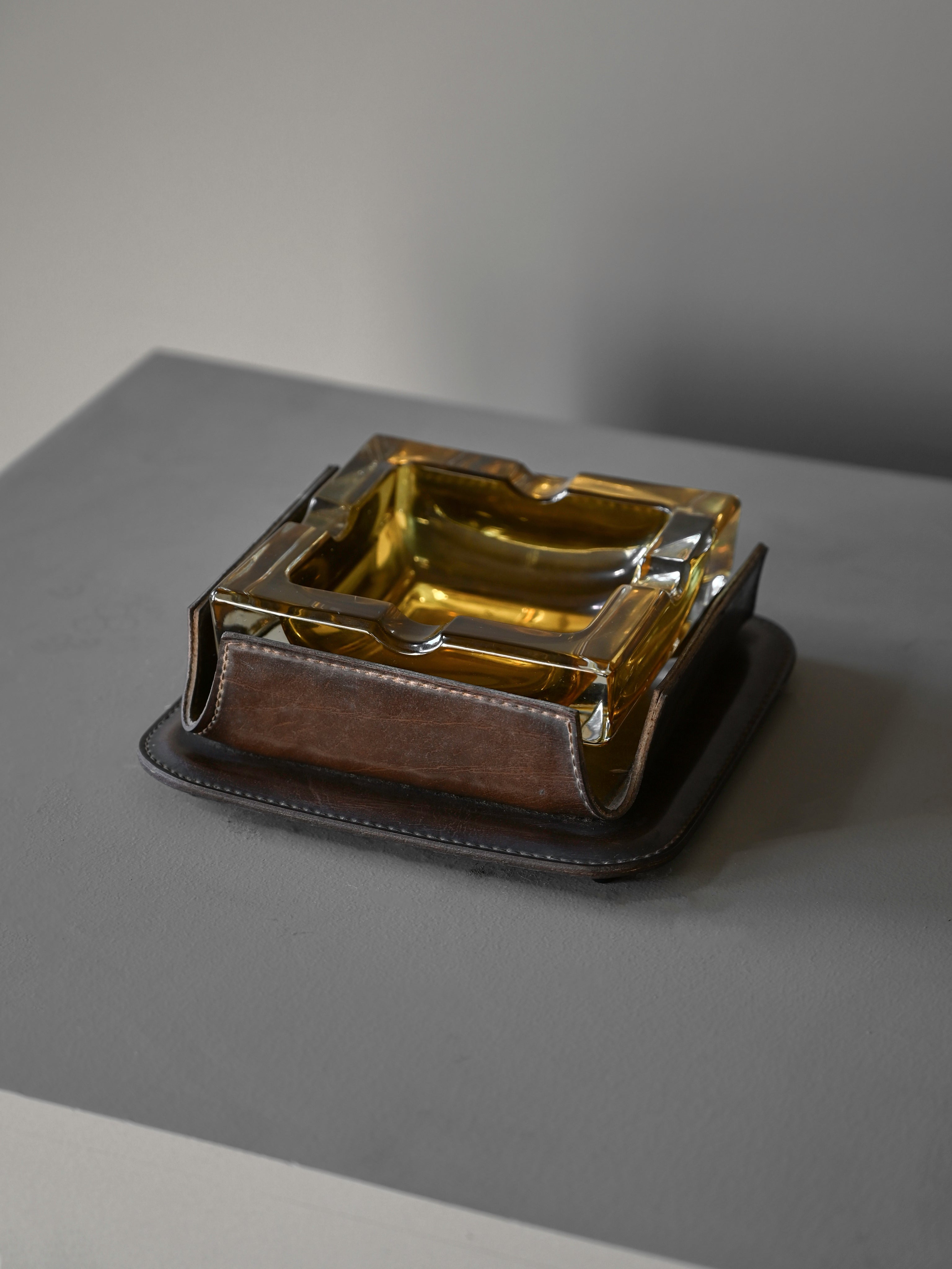 Cast-Glass and Leather Ashtray attributed to Jacques Adnet — lifestyle setting