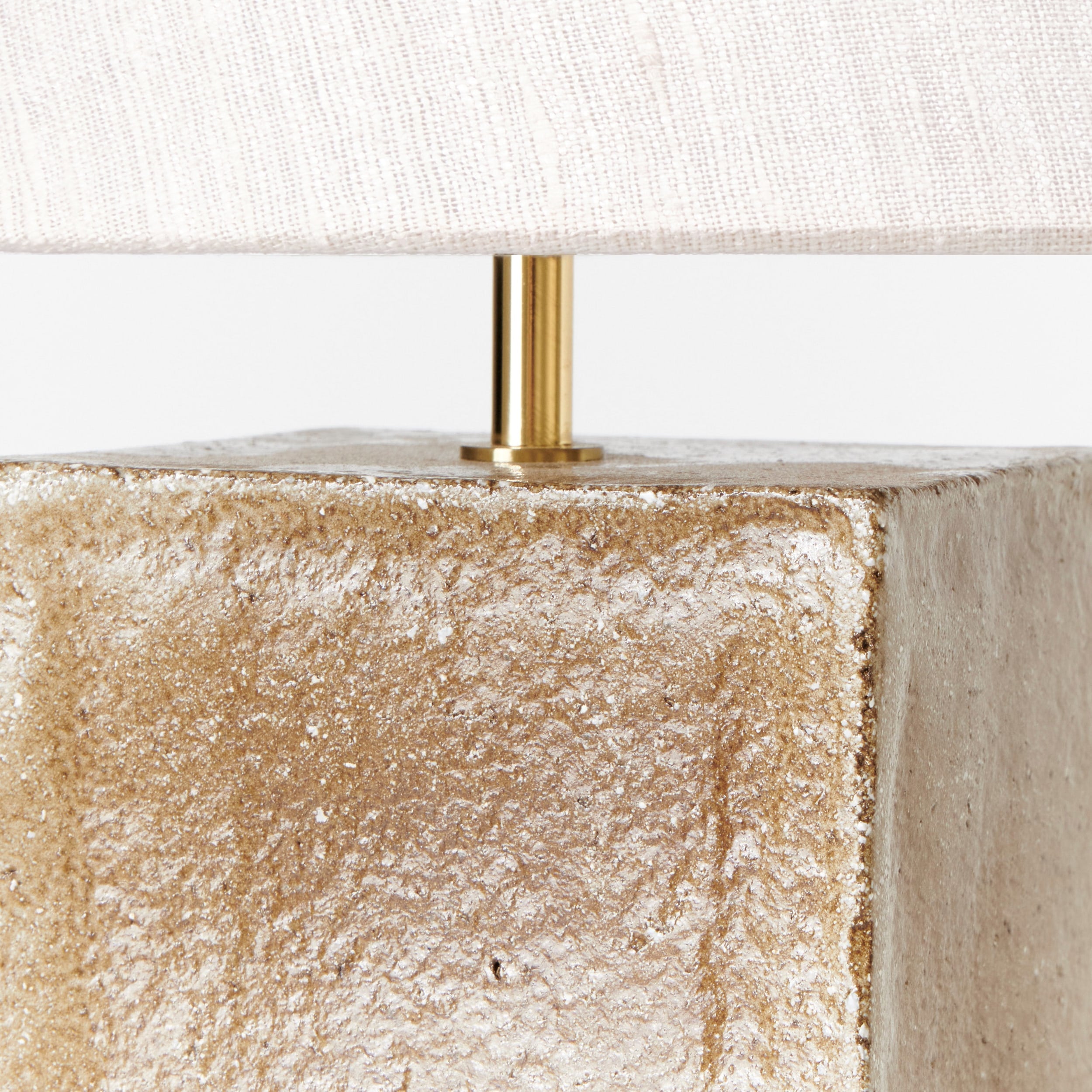 Arouca Table Light Red — close-up of textured concrete base