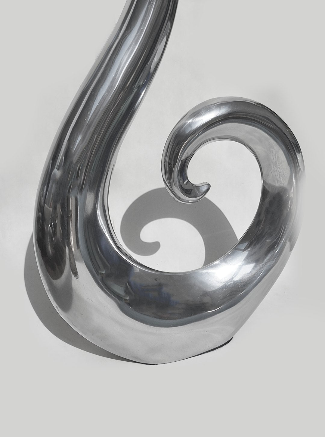 Large Spiral Vase — side angle showing polished metal finish