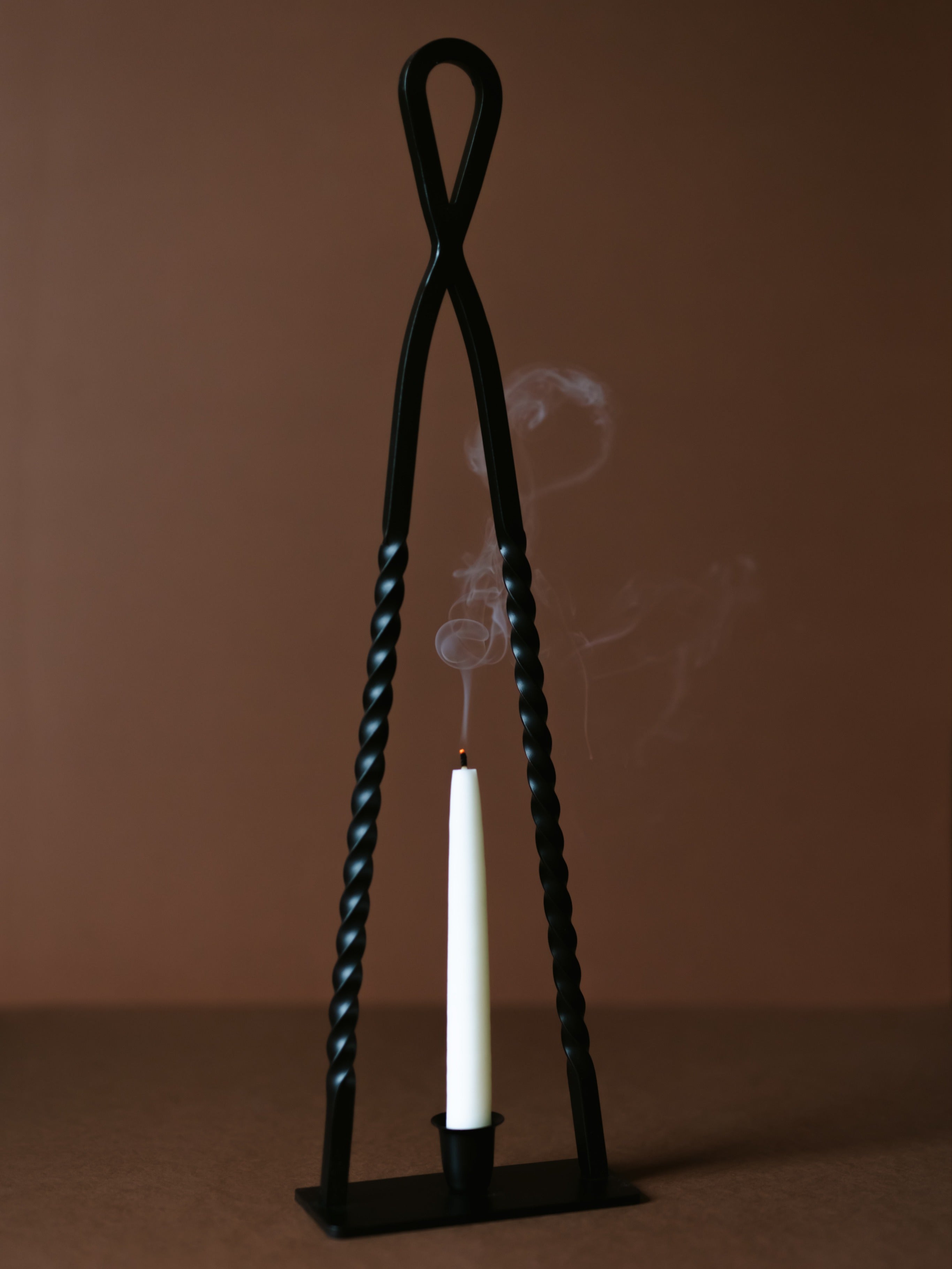 Alchemy Candle Holder — close-up of black twisted metal design