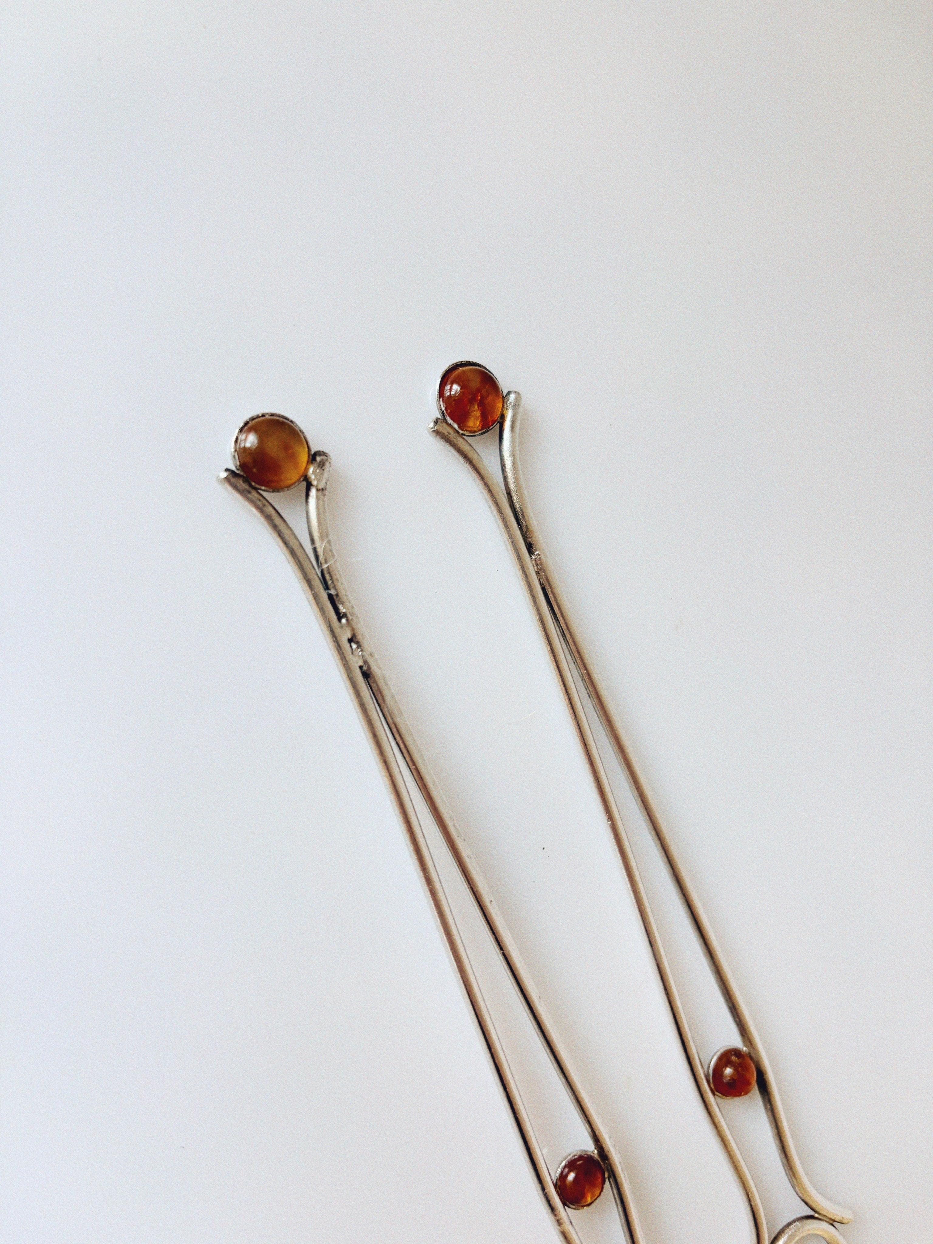 Silver Plated Serving Forks With Amber Inlay, Poland — close-up view highlighting amber inlays