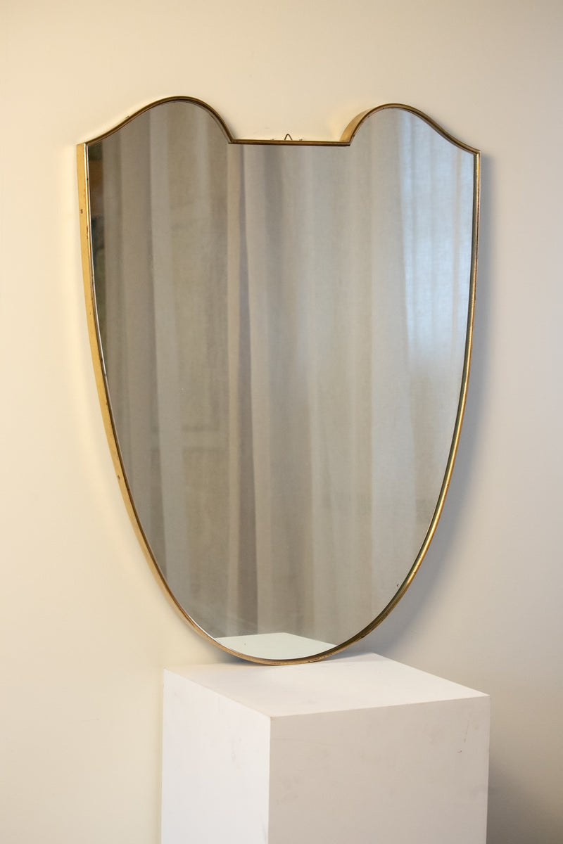 Large Midcentury Italian Brass Shield Mirror by Maud Vaughan | The Oblist — brass frame, reflective surface