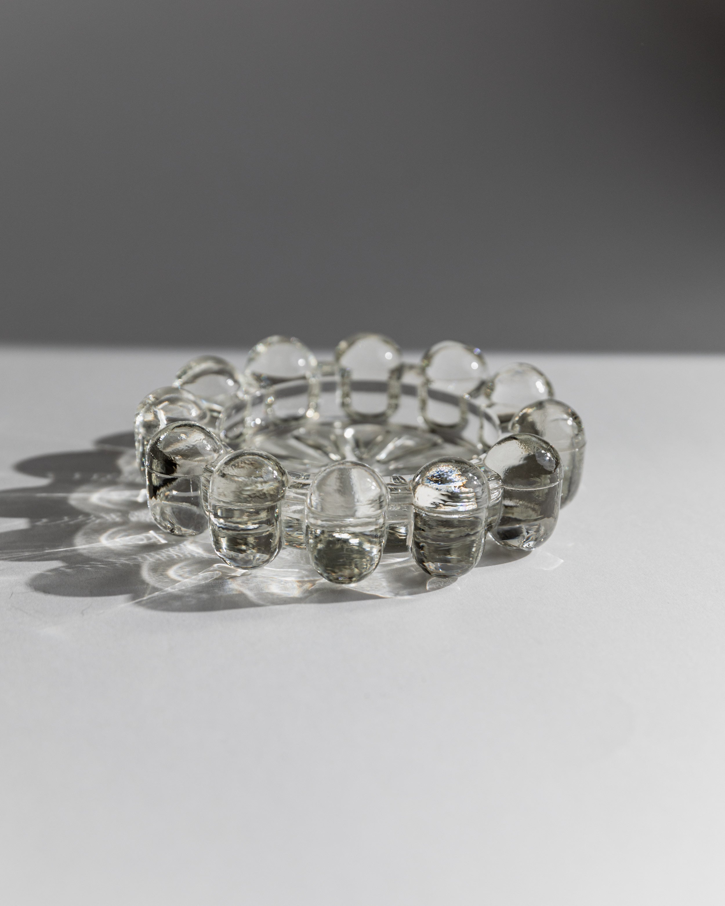 Clear glass ashtray with rounded bubble edges, 1970s Italian design